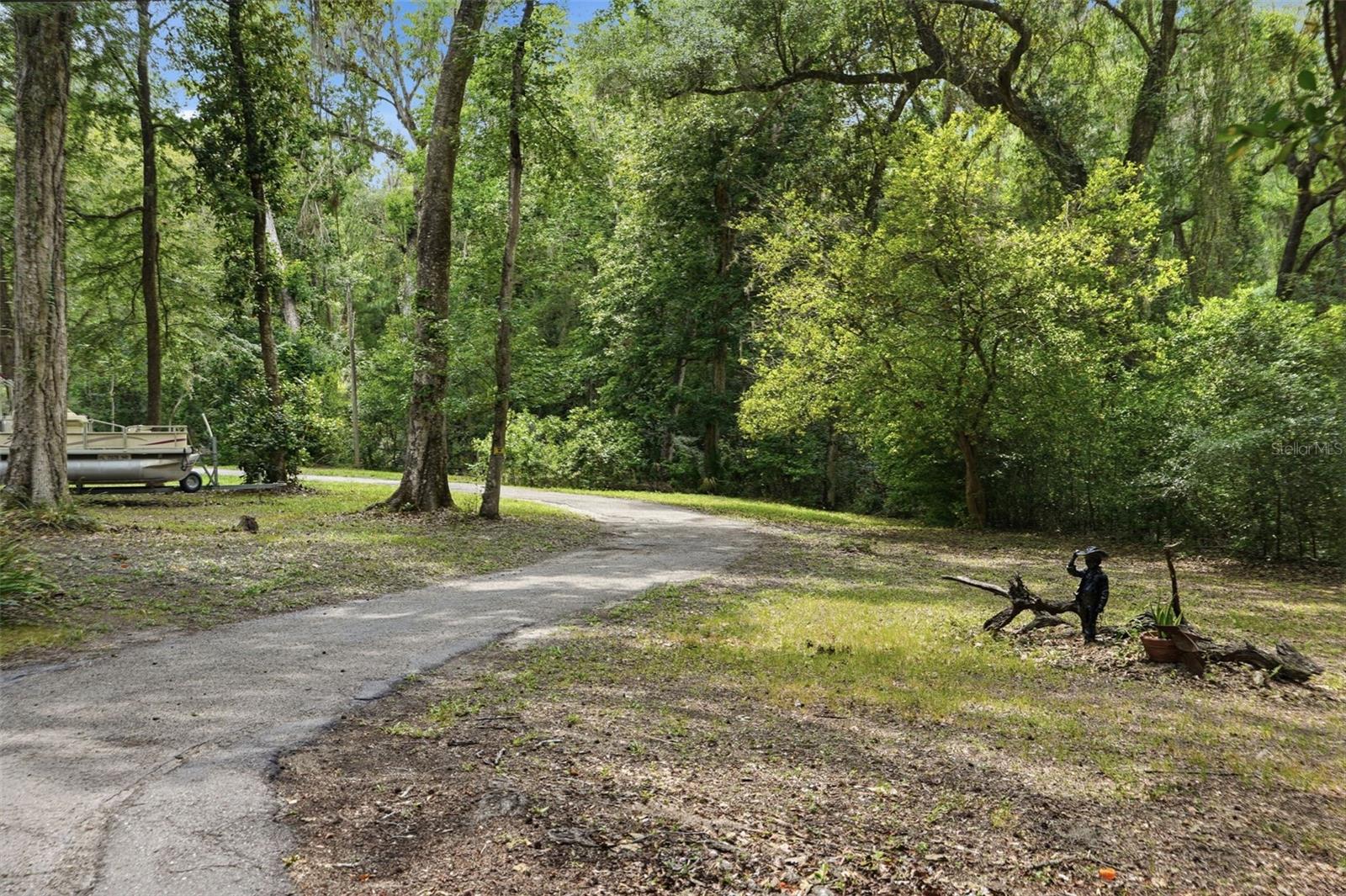"Winding Creek Drive" describes the property perfectly.