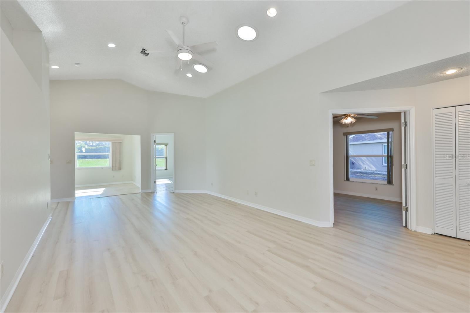 Great Room; Bedroom 3 with French doors, built-in cabinets, desk, window treatment and Murphy Bed.