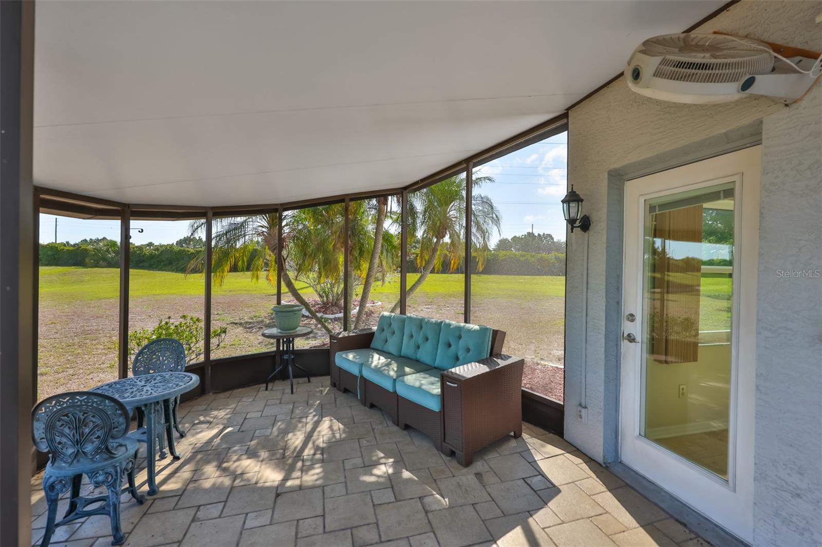 Screened lanai made for enjoyment, door to home and fan will keep you cool!