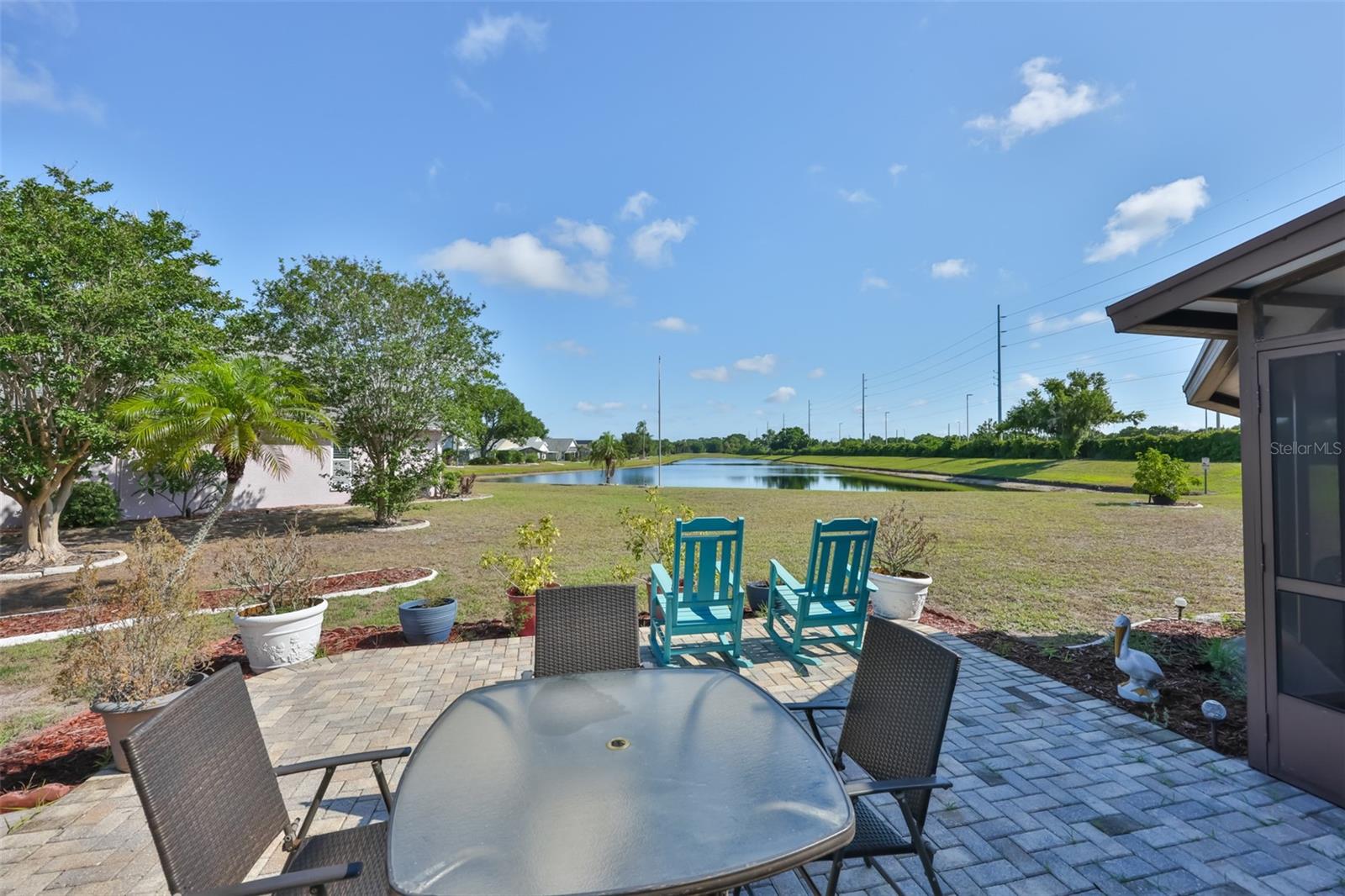 Outdoor patio perfect for grilling and entertaining. Enjoy the water and garden views.