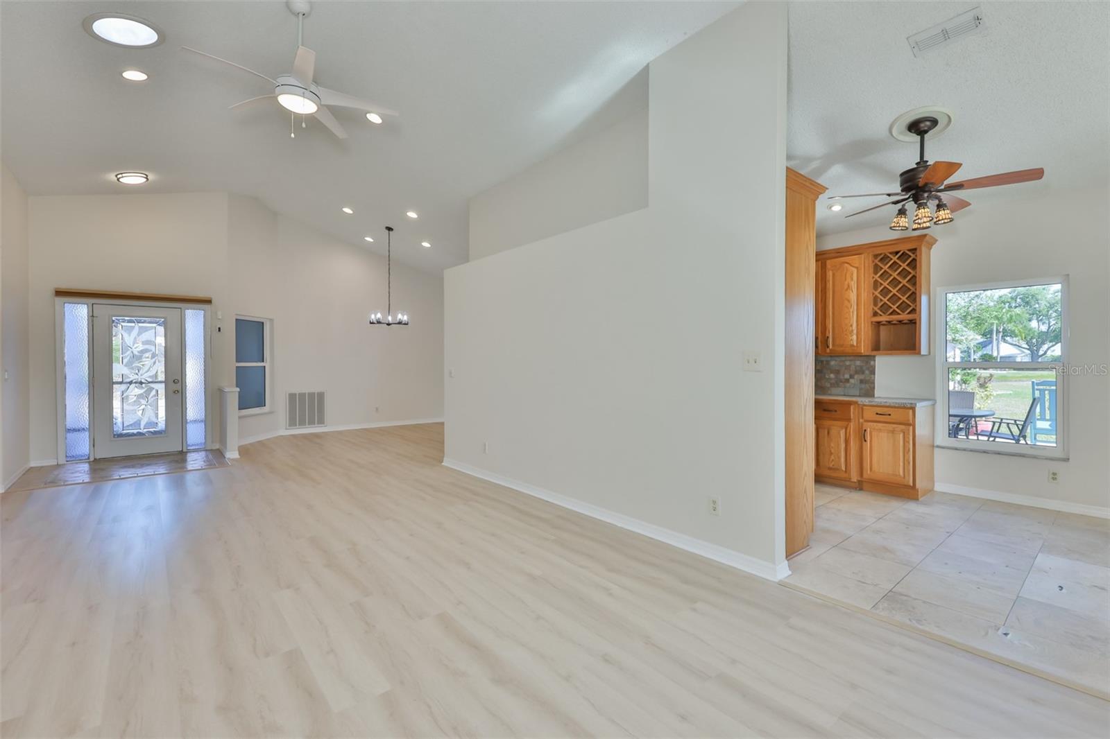 Great Room looking to Foyer; Kitchen and Breakfast Nook on right.