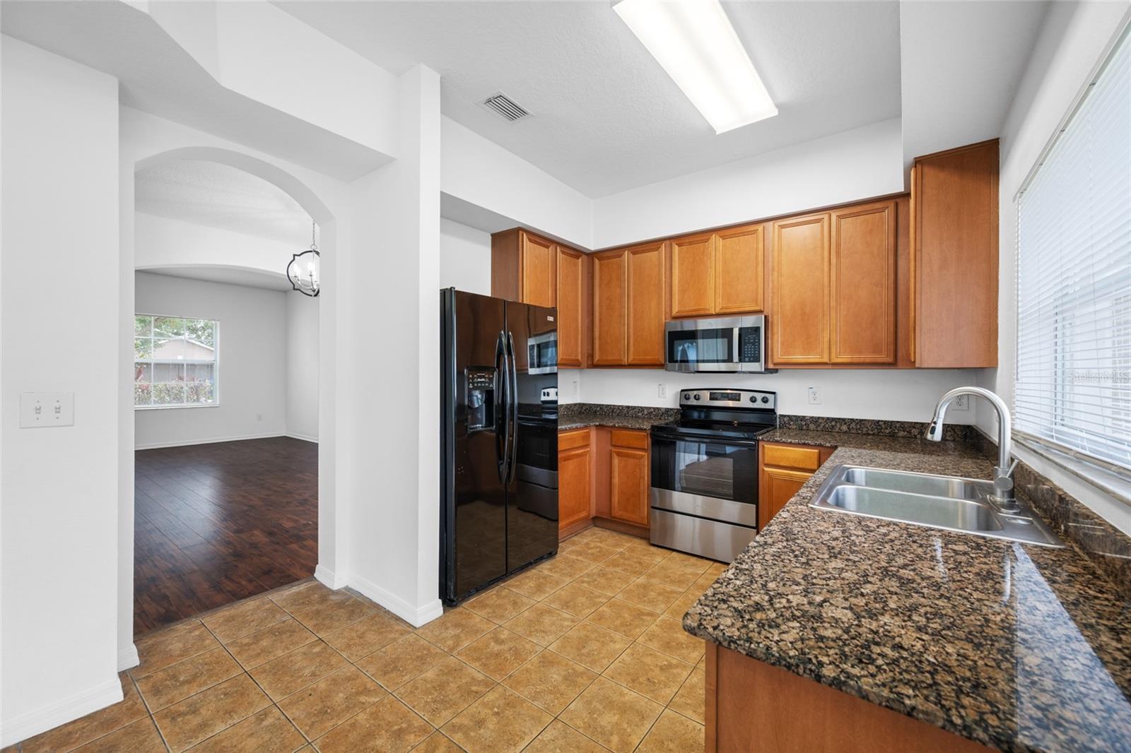 Kitchen with Plenty of Cabinets and Granite Countertops