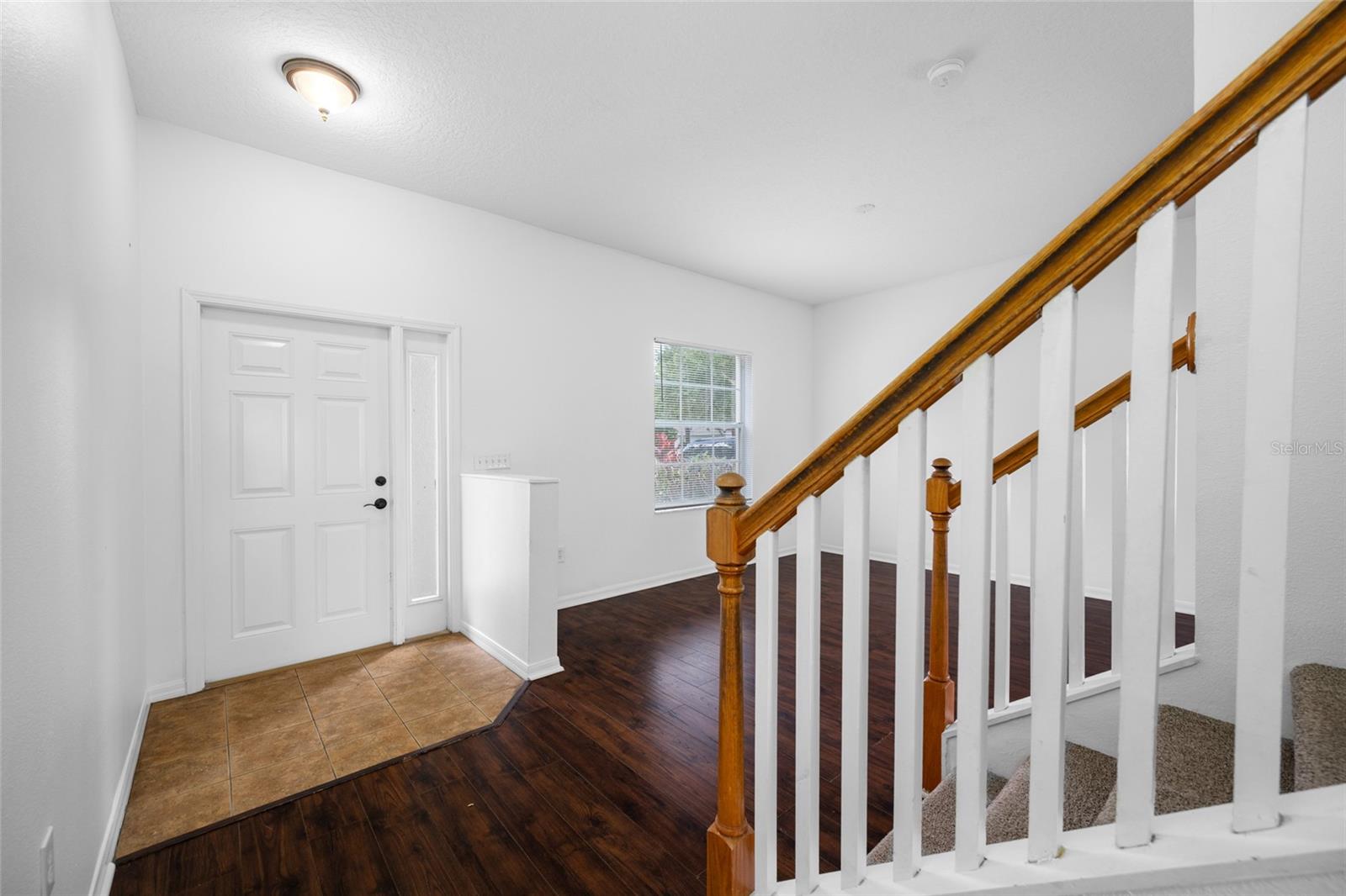 Foyer Entry into Open Floor Plan to Living/Dining Combo and Stairs to 4 Bedrooms or 1st Bedroom with Double Doors can be Game/Computer/Office or Family Gathering Room!