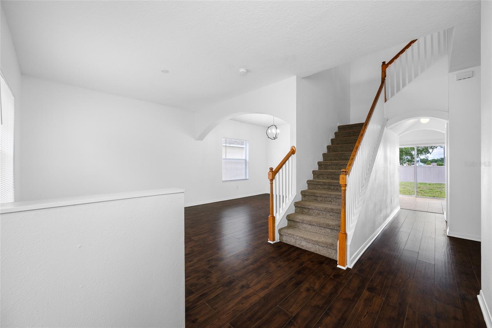 Foyer to Sliding Glass Door View of Living/Dining Combo to Backyard