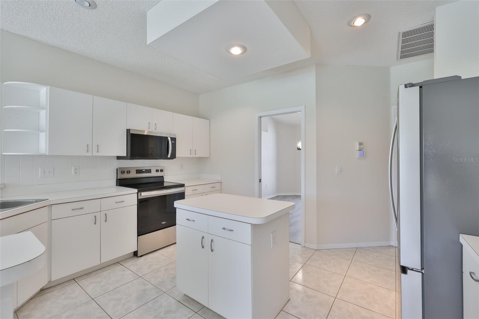 Cabinets and more cabinets! New French door stainless refrigerator with ice maker and water in door, new stainless microwave, range and dishwasher too!