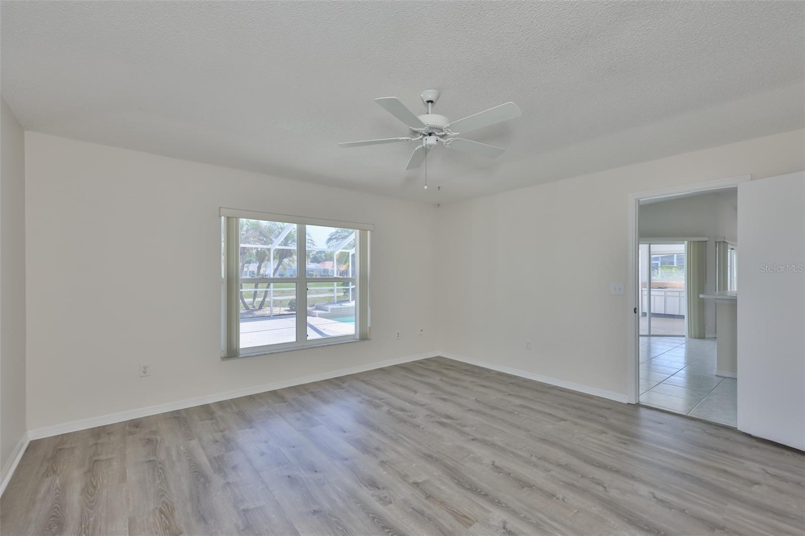 Primary bedroom; there's the pool. Look the other way, you'll see the pond.