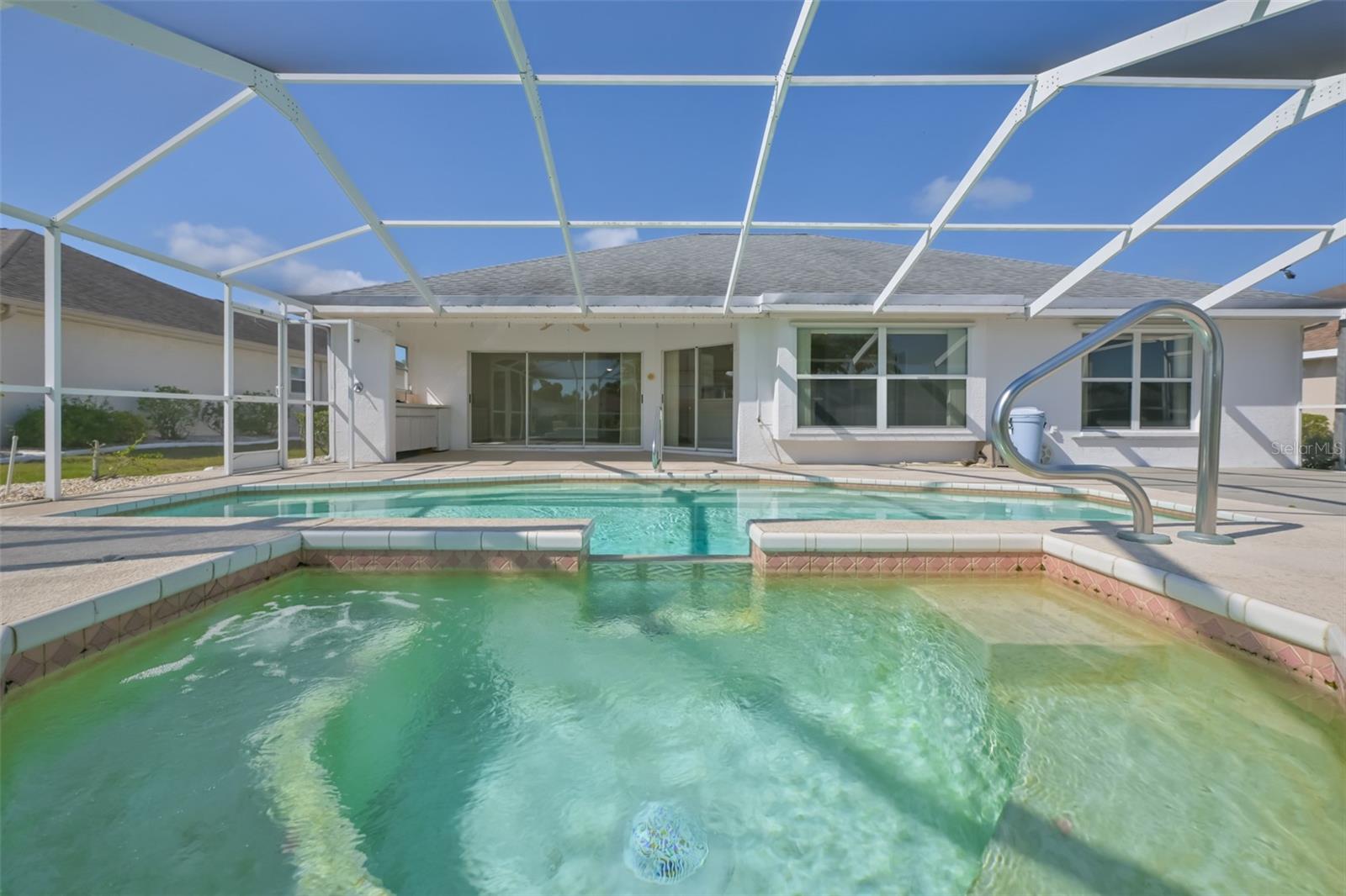 Two sets of sliders, outdoor kitchen plenty of room for lounging, sun bathing, grilling - yaaaaay!