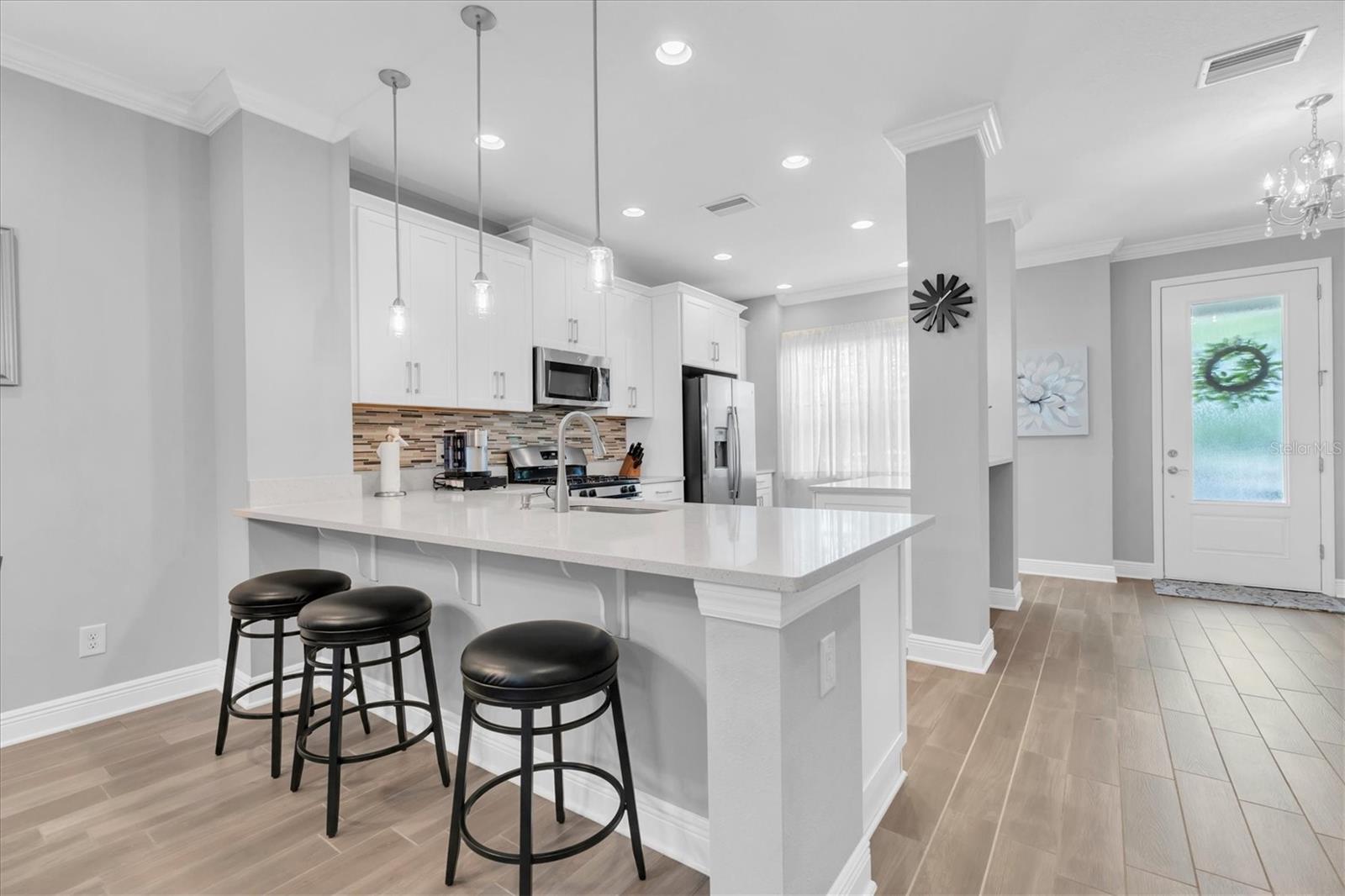 UPGRADED CHEF'S KITCHEN WITH ISLAND BREAKFAST BAR