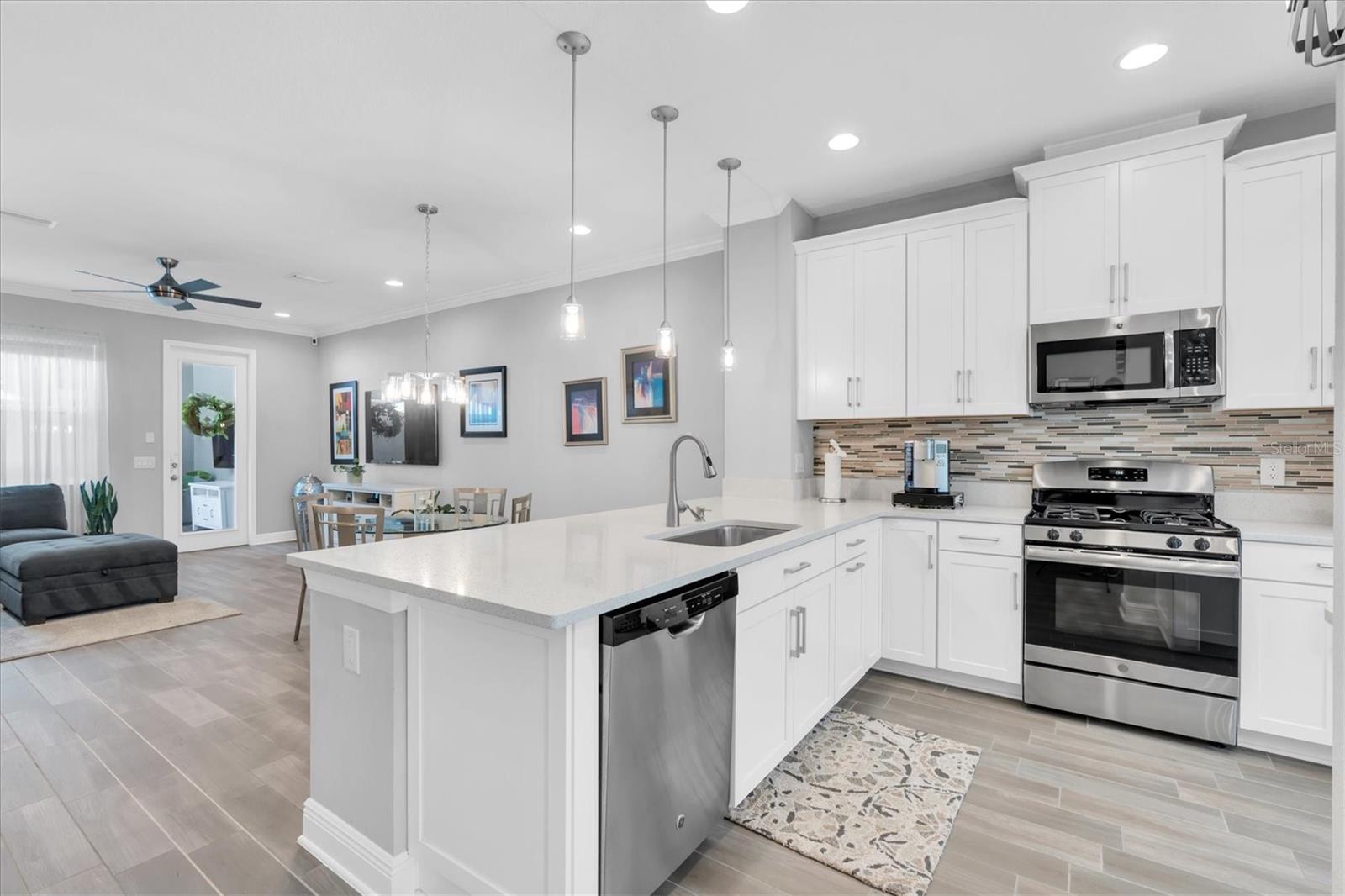 QUARTZ COUNTERS & PLENTY OF CABINET STORAGE