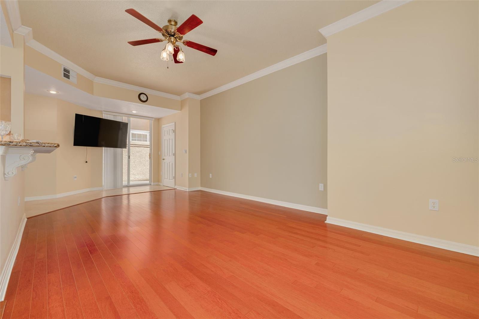 Family room, adjacent to the kitchen, with sliders to the private courtyard