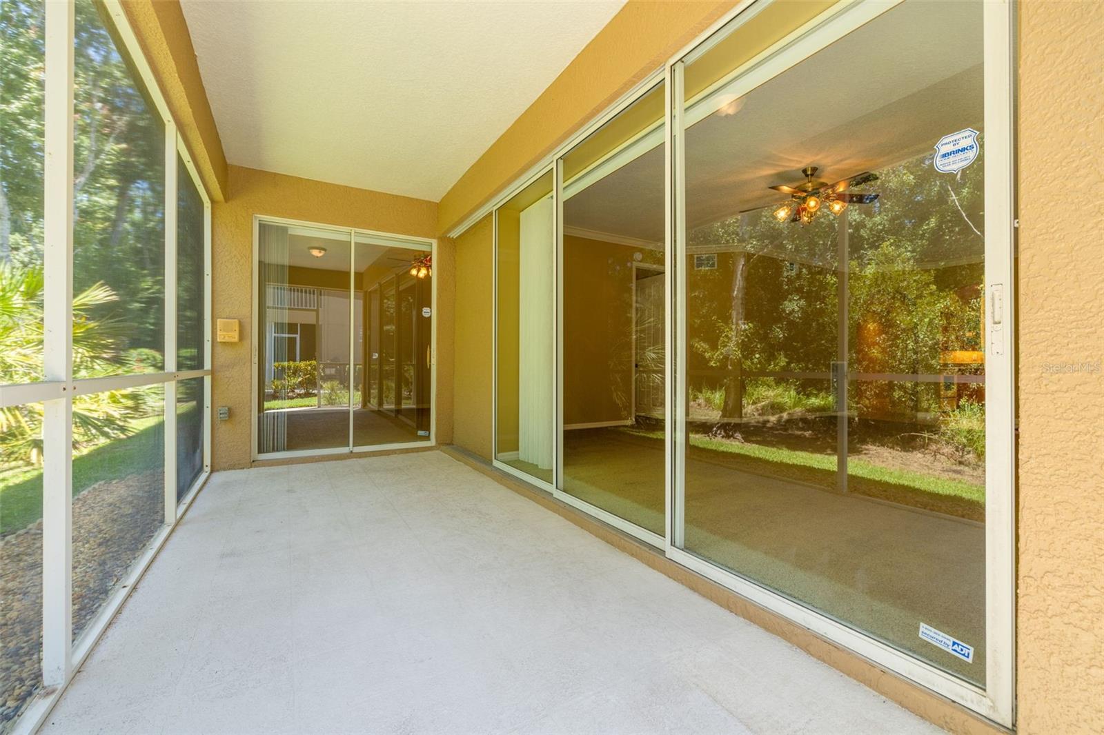 Sliders from the living room and from the primary bedroom lead to the screened lanai