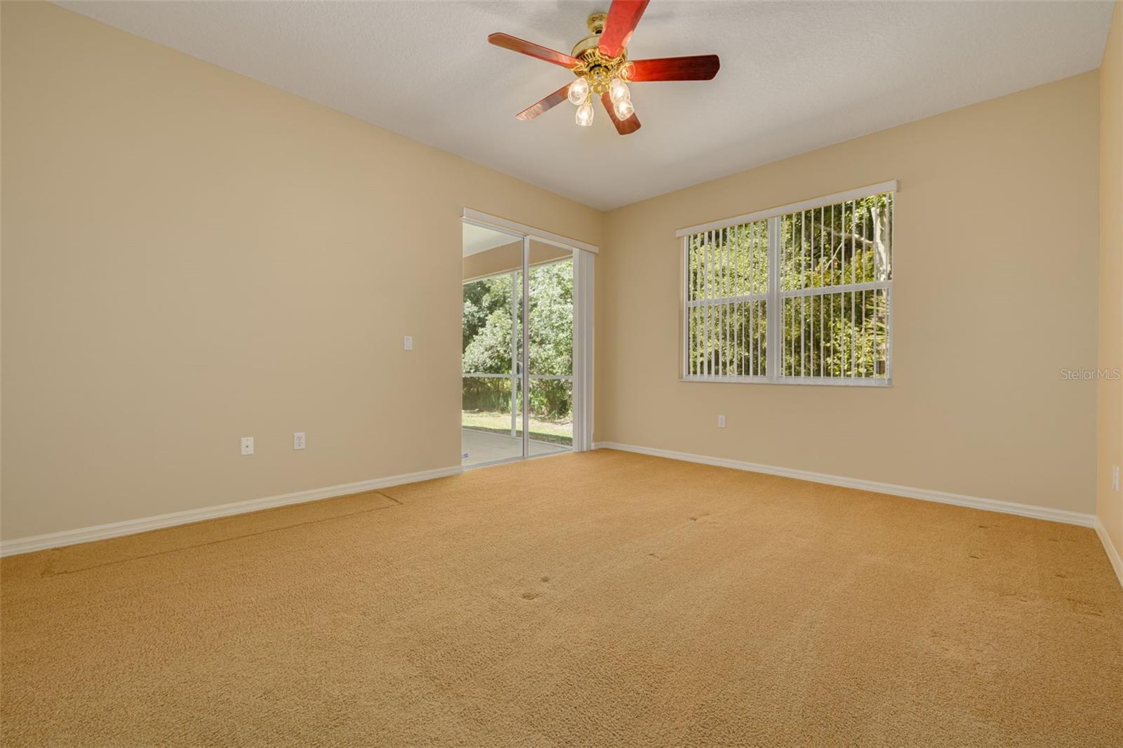 Primary bedroom with window that overlooks conservation