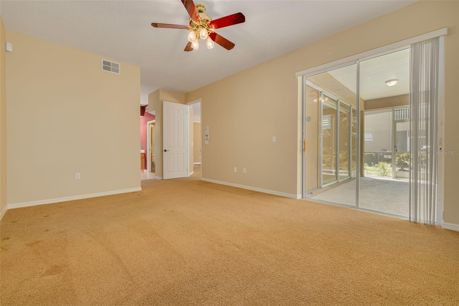 Primary bedroom with door-free entry to the bathroom