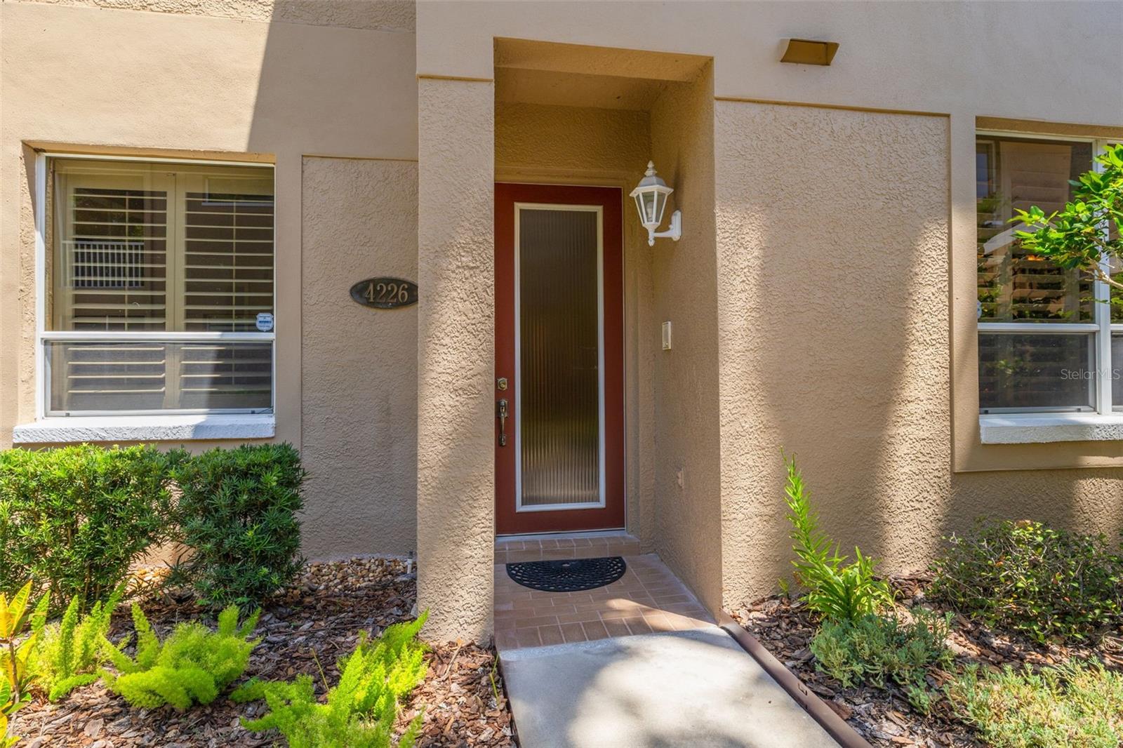 Private front door on this 2/2 Palm Harbor condo with a garage!