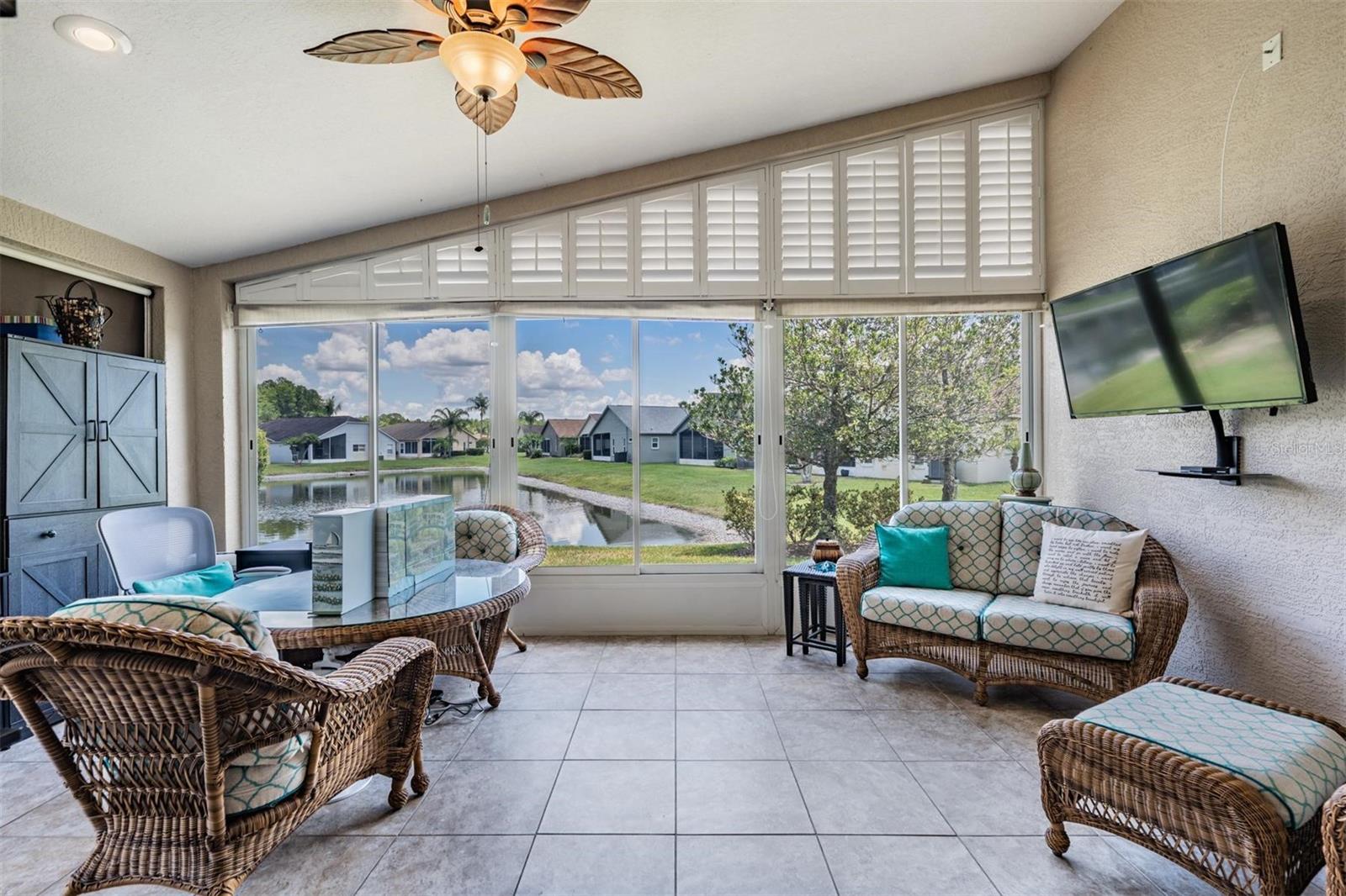 Florida room with a pond view