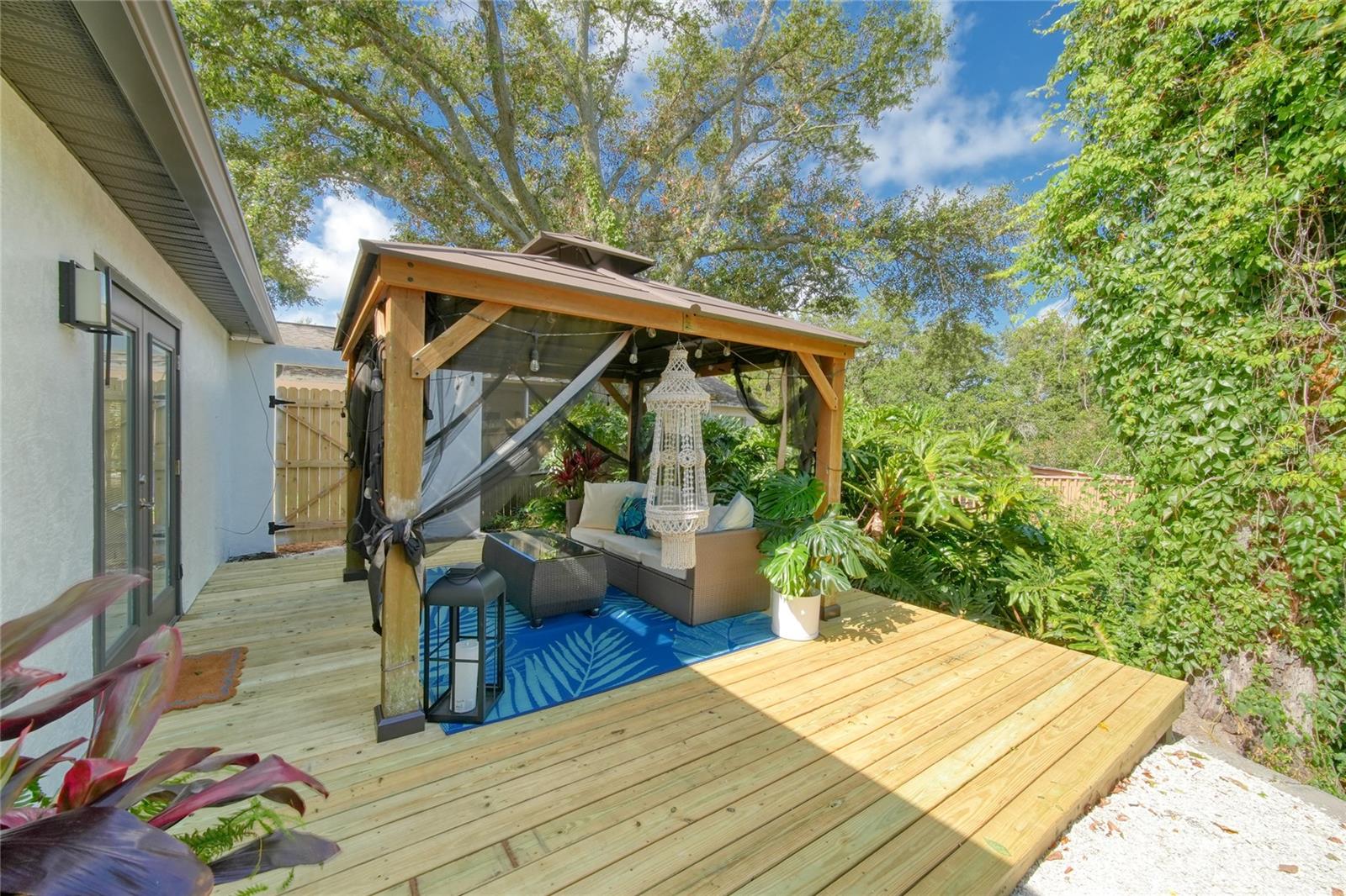 Whether you're entertaining friends or unwinding after a long day, this outdoor space is designed to be enjoyed year-round.