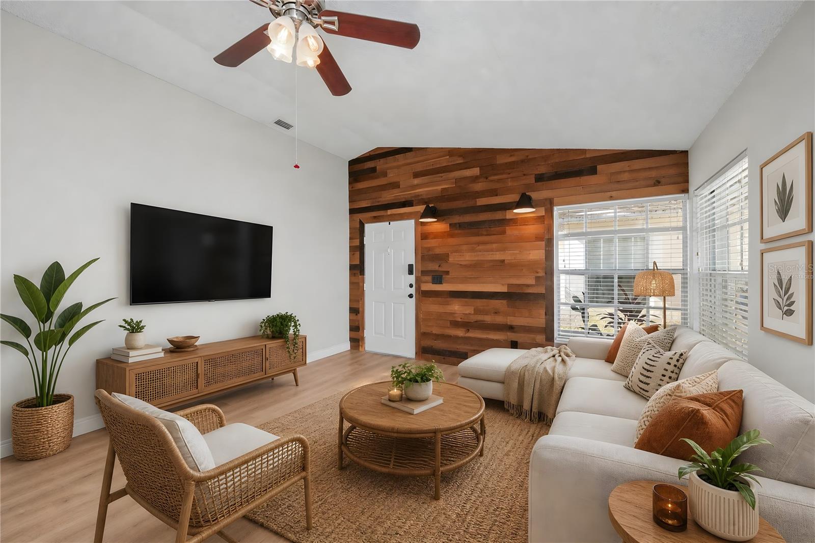 Virtually Staged -Natural light fills the spacious living room, creating the perfect space for relaxing or entertaining family and friends.