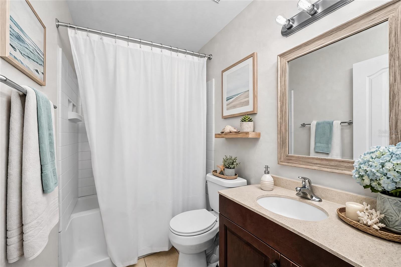 Virtually Staged - Clean and functional En Suite Primary bathroom designed for comfort and convenience.