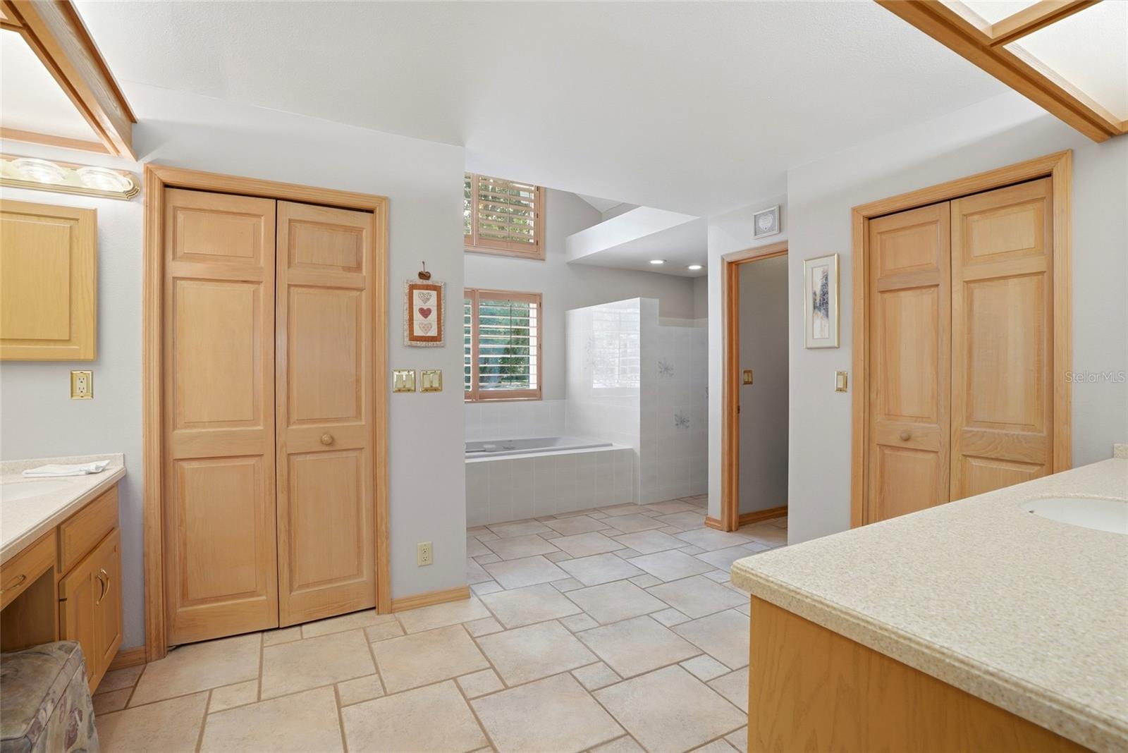 Primary Bathroom ensuite withdual walk in closets andcustom built ins