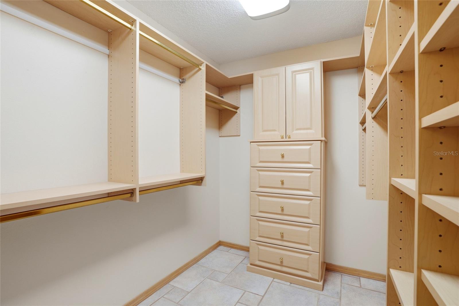 One of two primary Walk inclosets with custom built-ins