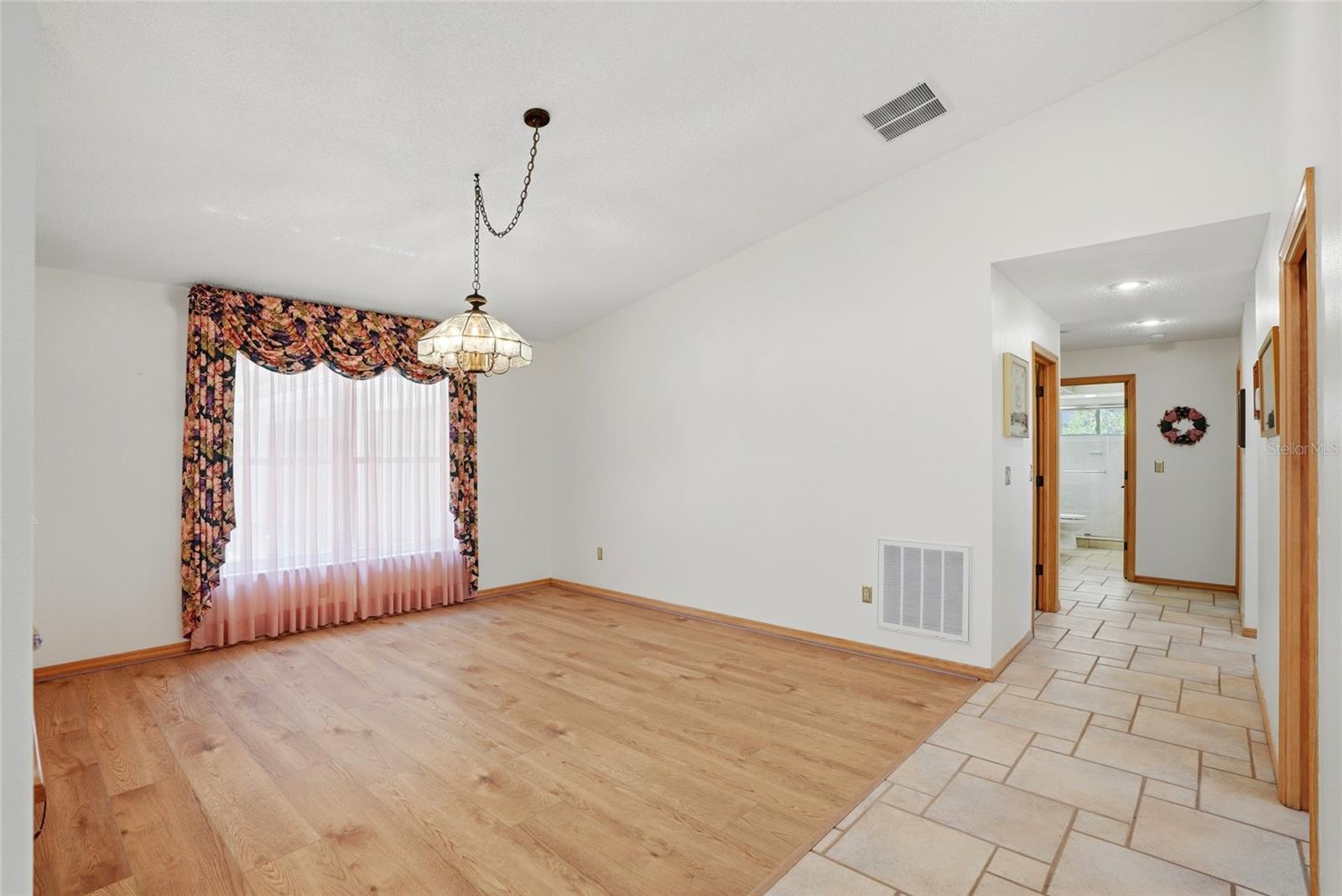 Dining room, to the right arebathroom 2 and bedrooms 2and 3, both with stunning lakeviews