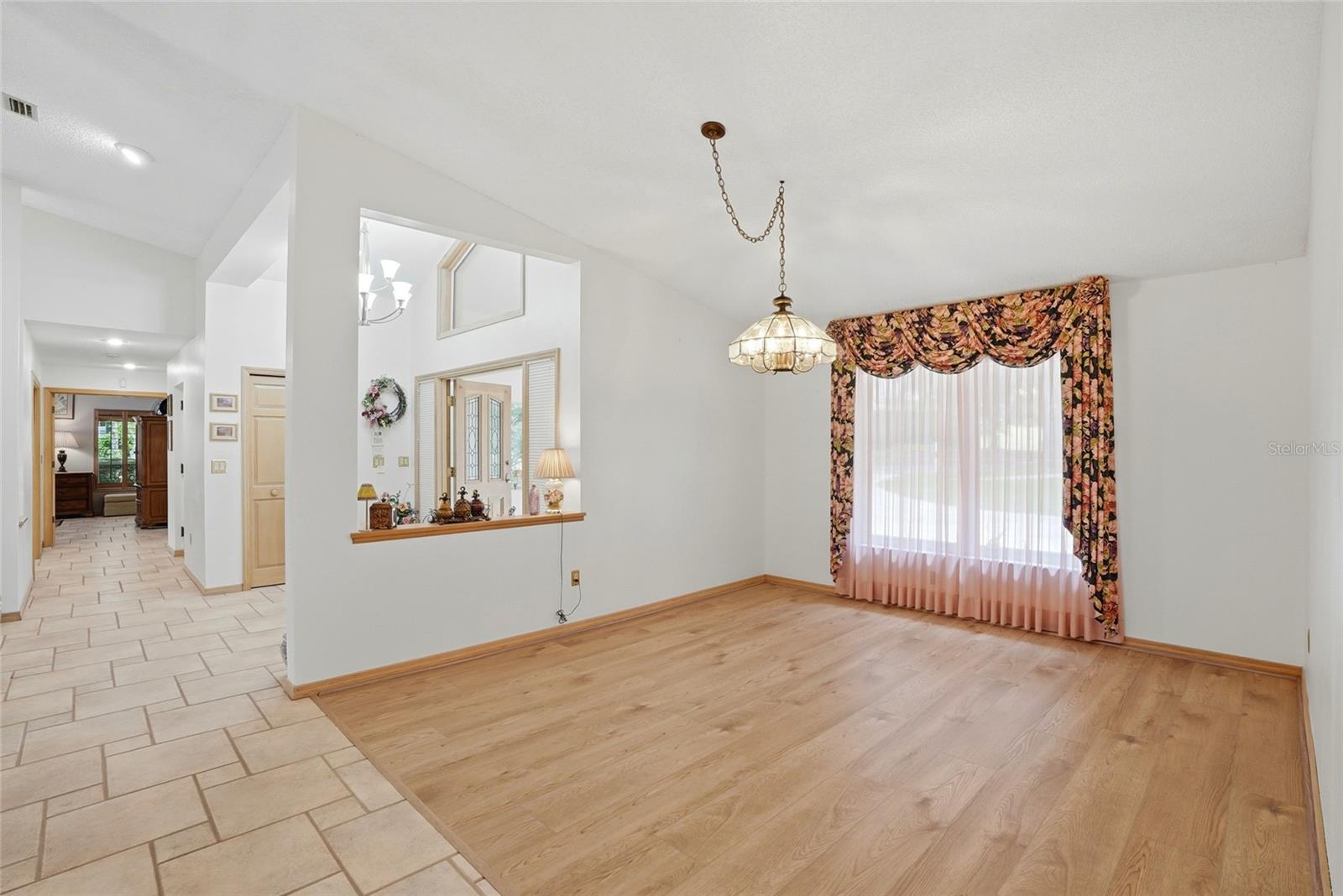 Dining room, to the left yourprimary with ensuite andbonus room, both withbeautiful lake views