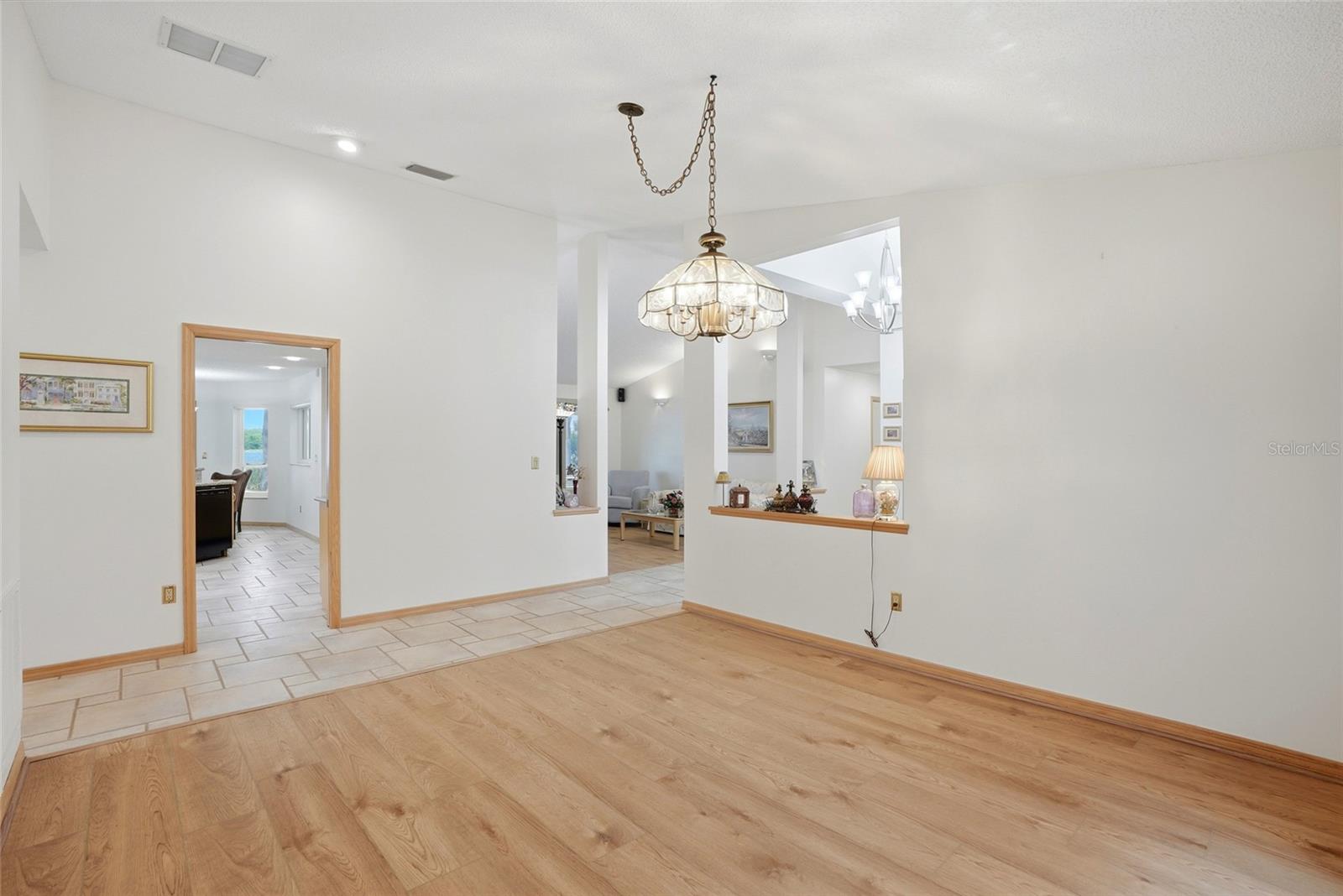 Dining room leading into thekitchen and family room