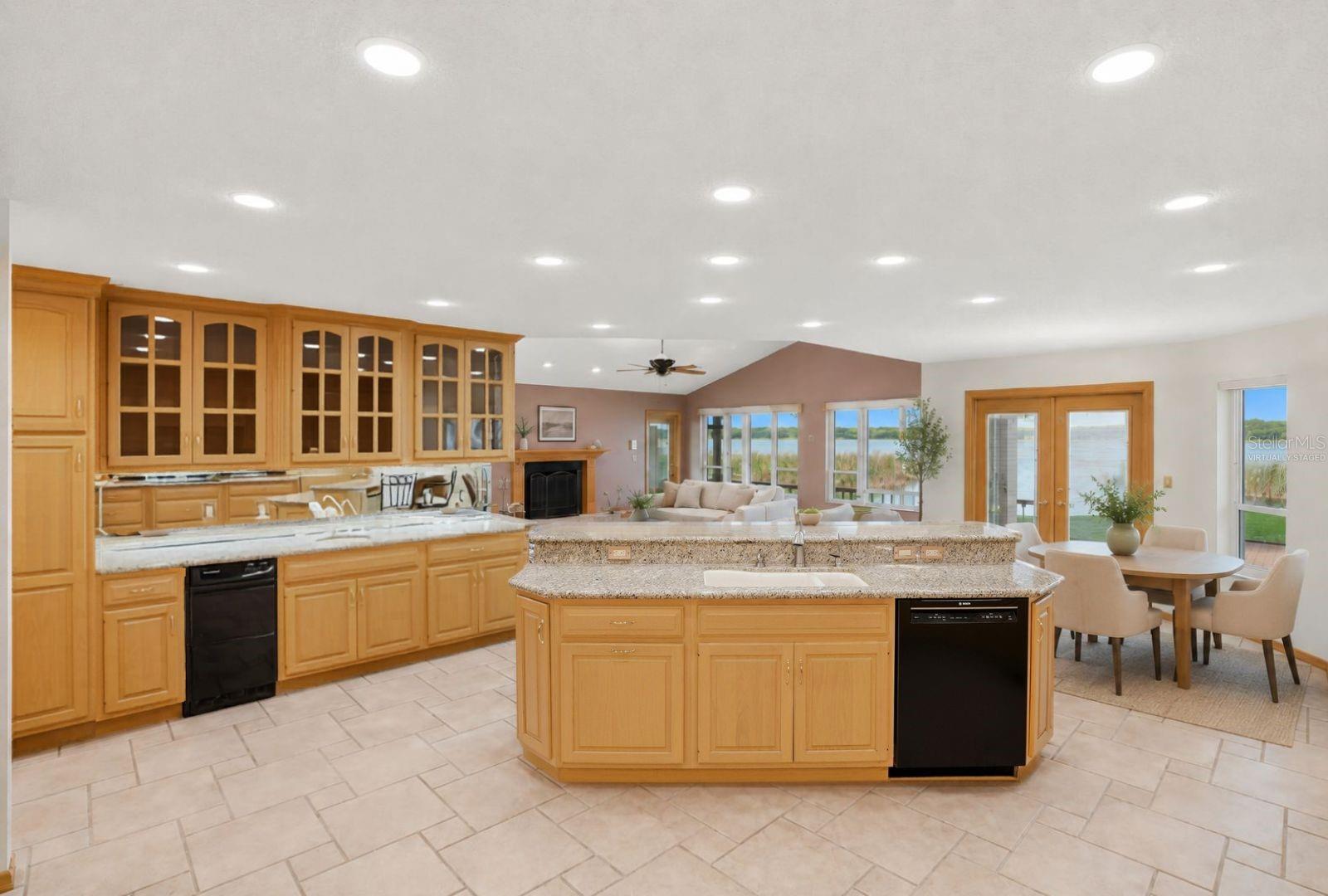 Updated kitchen with granitecountertops, custom woodcabinetry, wet bar andbreathtaking views of LakeTarpon. Flows seamlessly intothe family room, breakfast areaand pool. Virtually staged