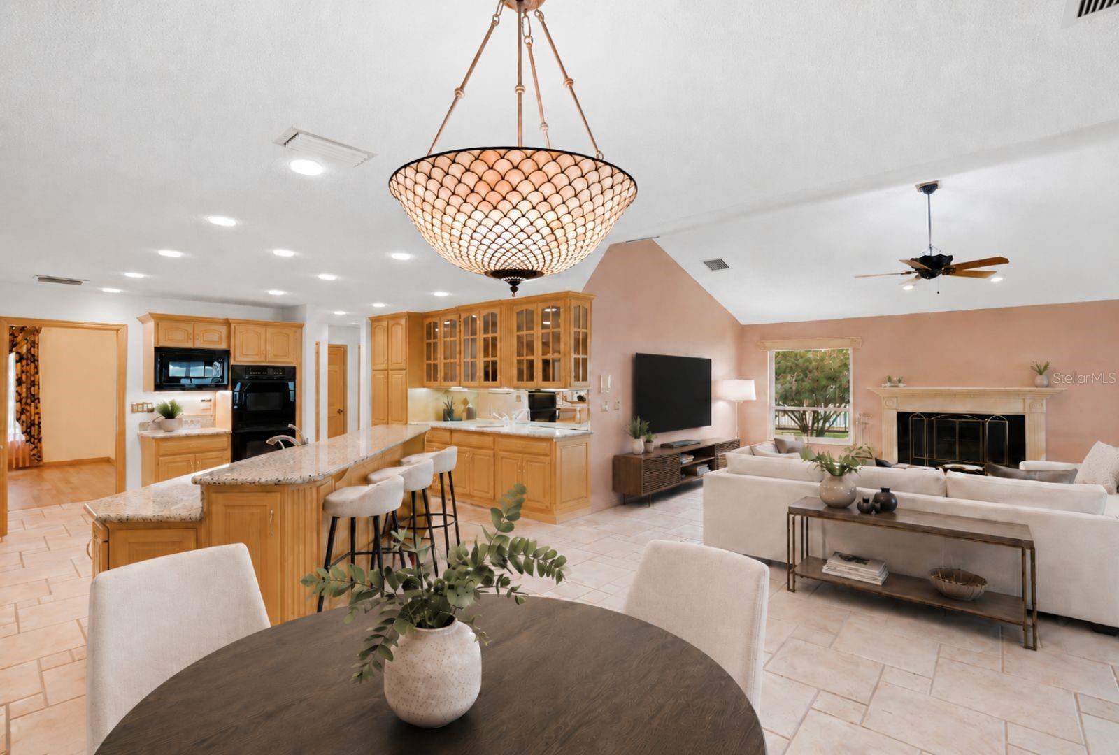 Breakfast area, kitchen andfamily room all with gorgeousviews of Lake Tarpon hurricaneimpact rated windows andFrench doors to the enclosedpool.. Seamless flow to thekitchen, breakfast area, 3rdbath and pool area -virtuallystaged
