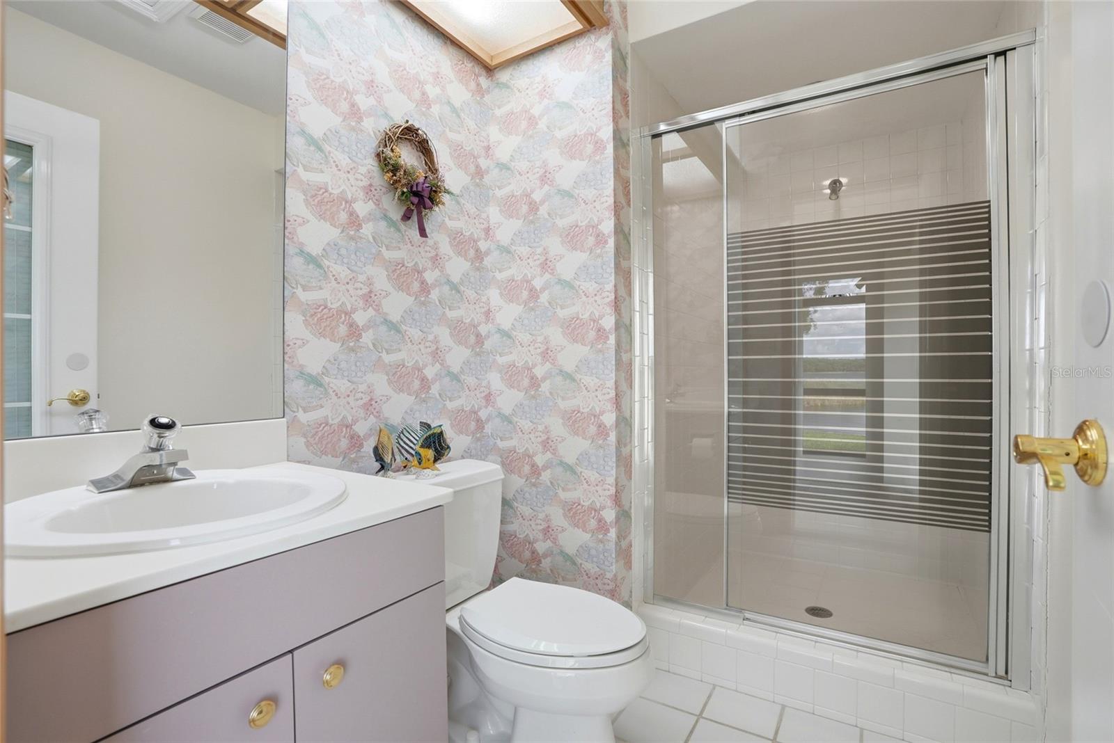 Bathroom 3 is included in airconditioned space just off thefamily room and easilyaccessible for utilization asboth a guest and poolbathroom