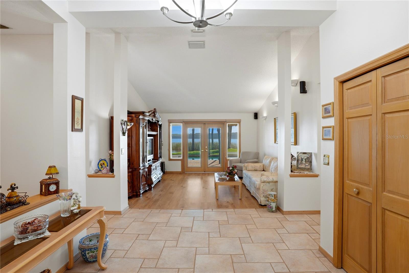 You are immediately welcomed with a beautiful view of the lake from your entry way and living room.