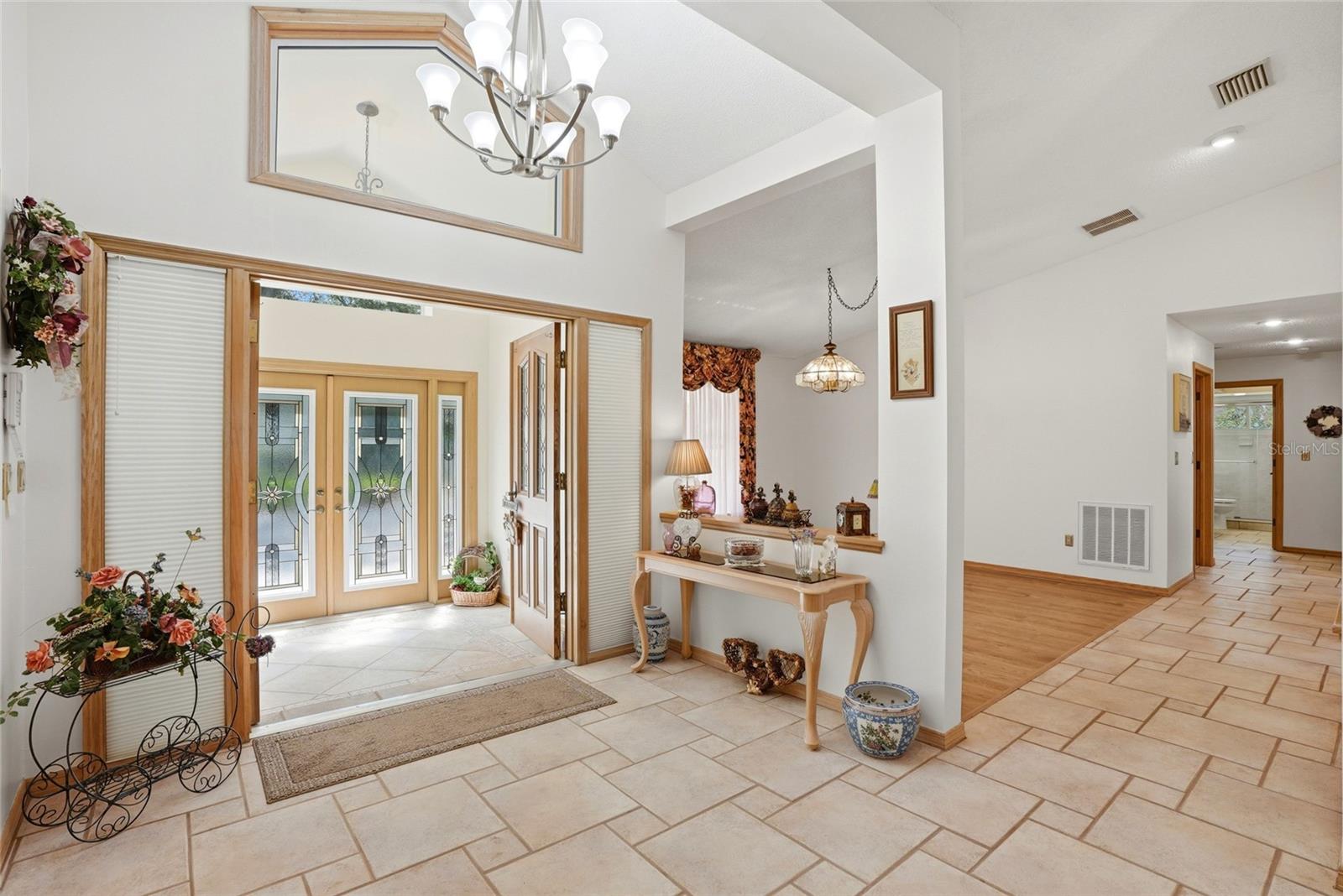 Foyer with grand entry.Exterior doors are hurricaneimpact rated