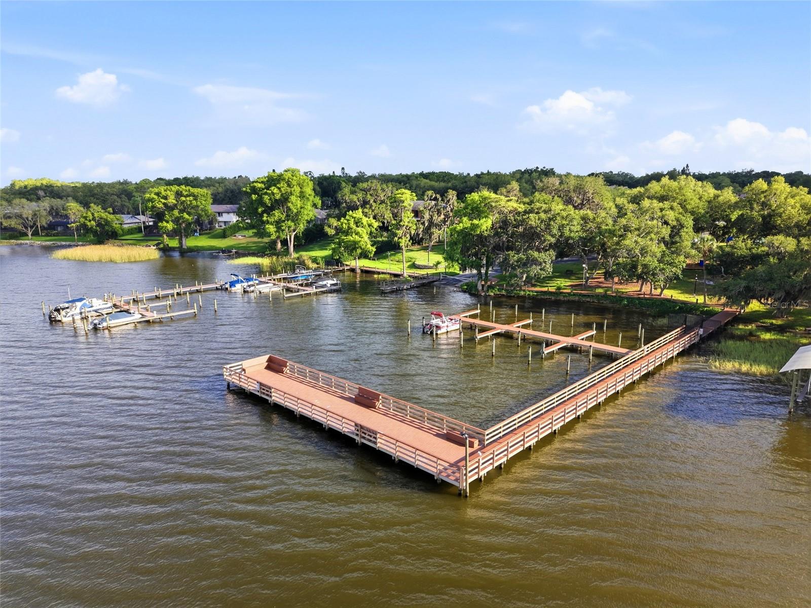 Residents enjoy a private gatedmarina with boat slipsavailable on Lake Tarpon and agated boat ramp, a privategated community pier, a nineacre common area park, awalk-out gazebo overlooking alarge pond with a fountain,paved walking pathsthroughout the common areas,a playground, two gated tenniscourts, and a basketball court.
