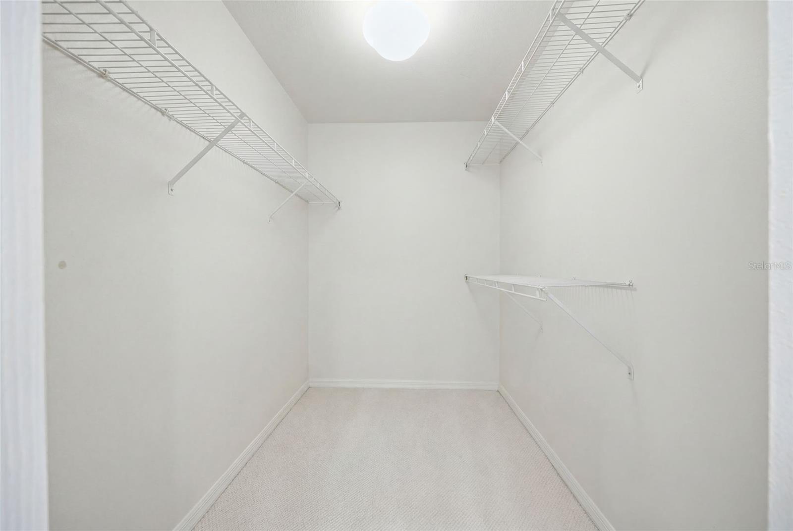 Spacious walk in primary closet