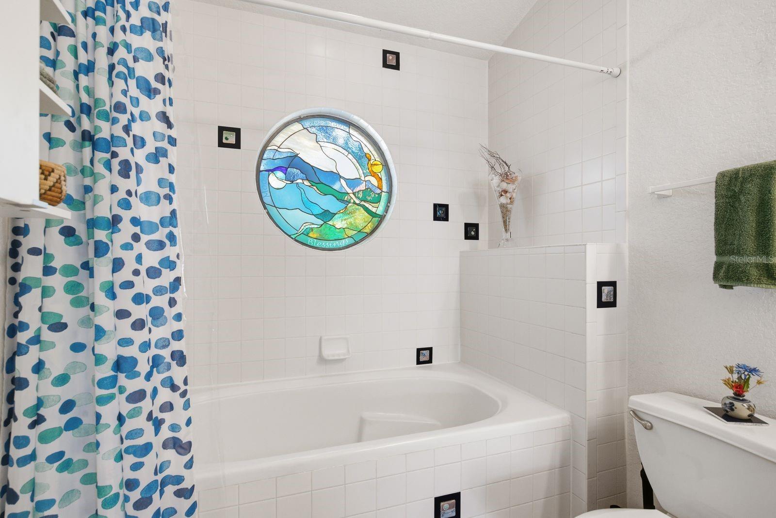 Custom Coastal stained glass and custom handmade fused glass tiles.