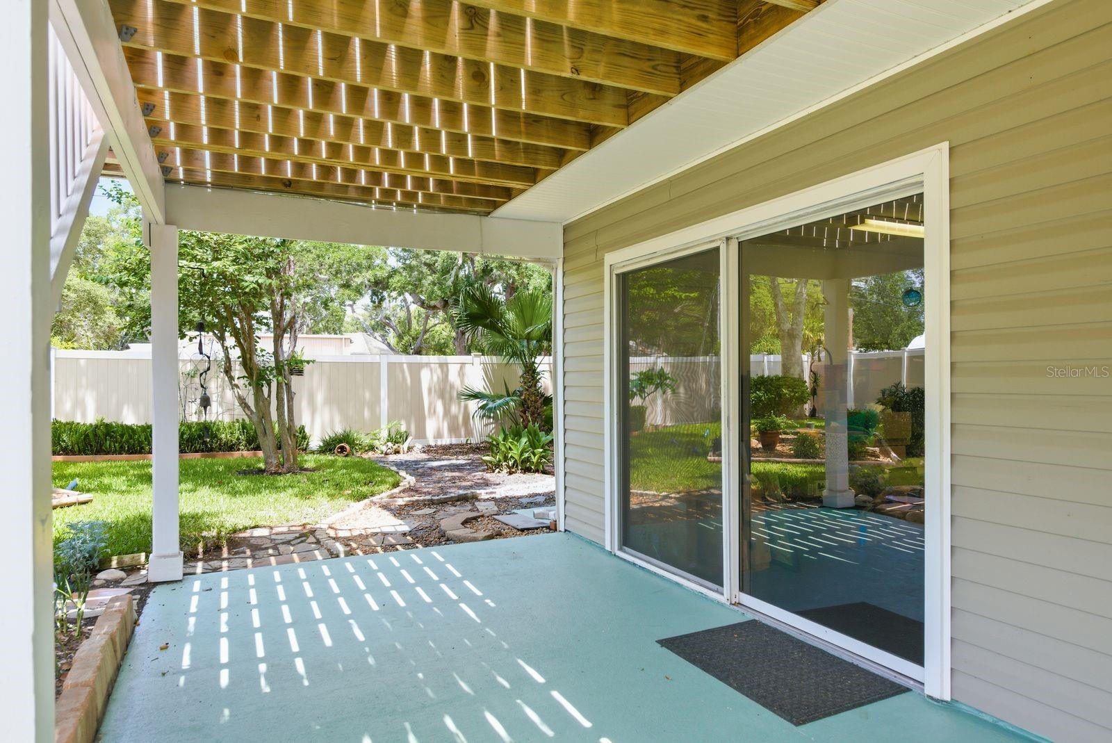 Downstairs sliding glass doors from bedroom 2/workshop.