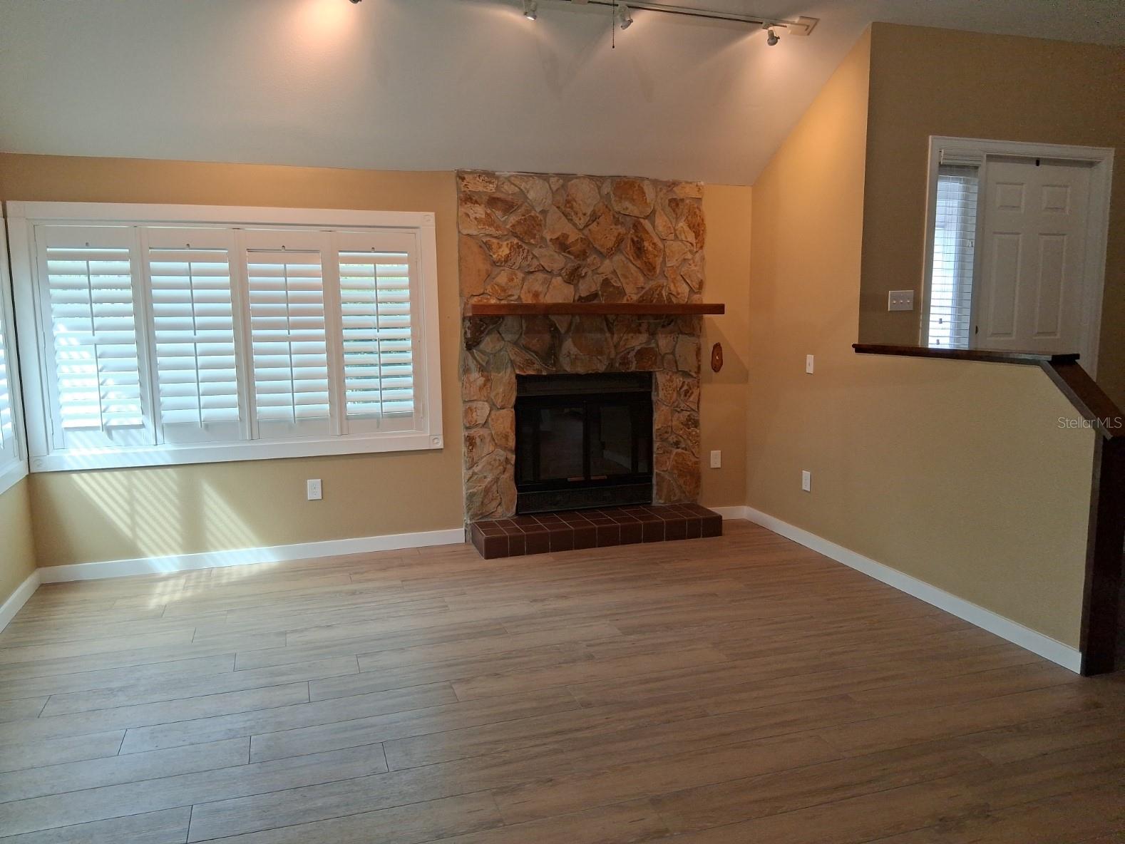 Living room with wood burning fireplace