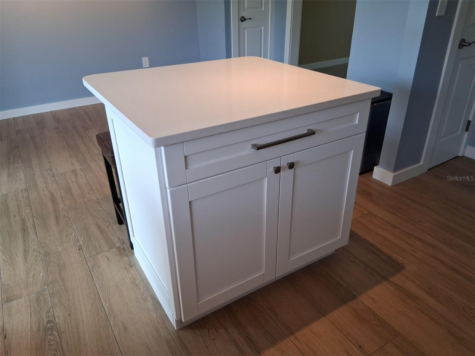 Cooking island which doubles as a breakfast bar.