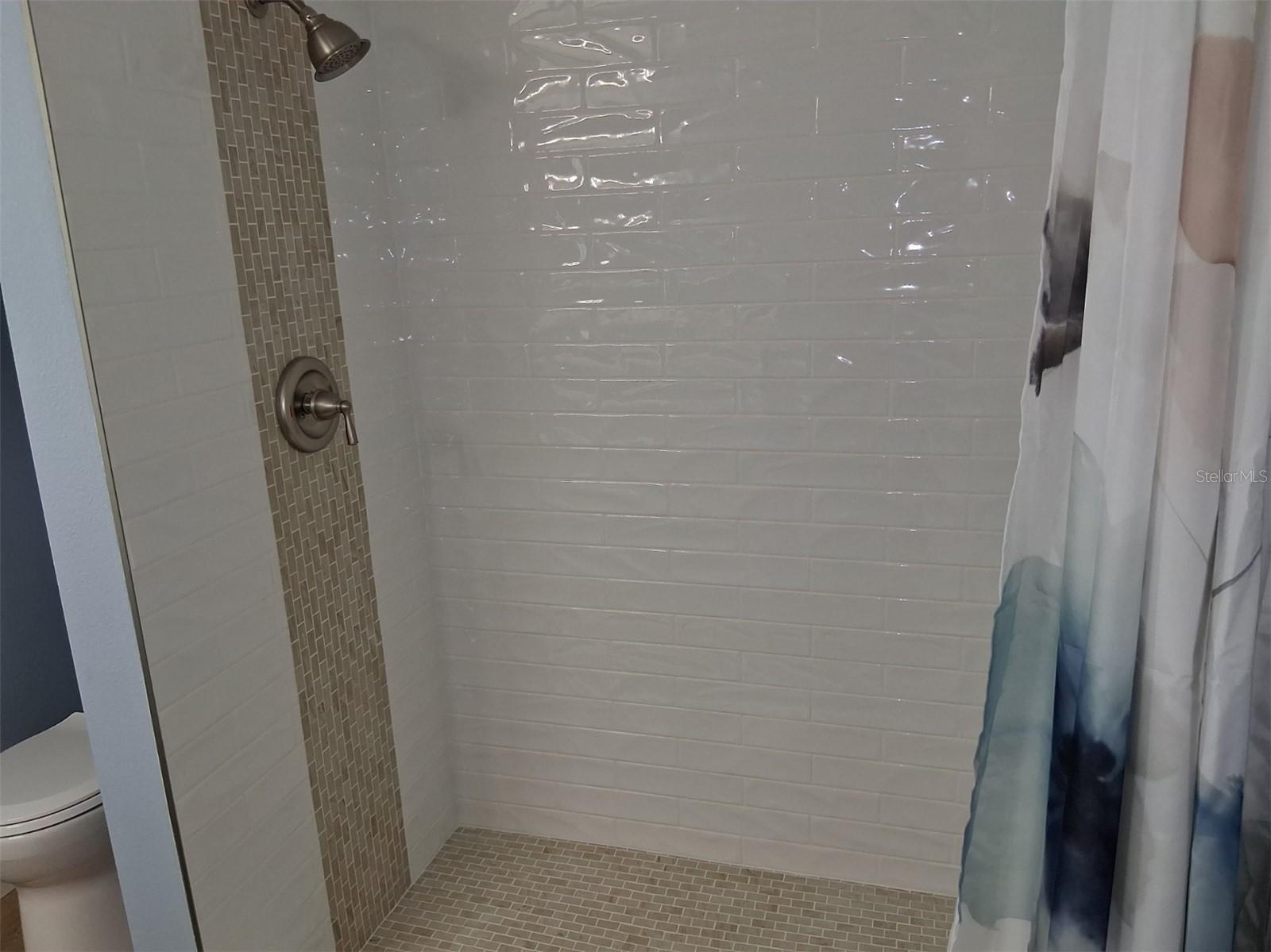 Downstairs bath - large, tiled step-in shower!