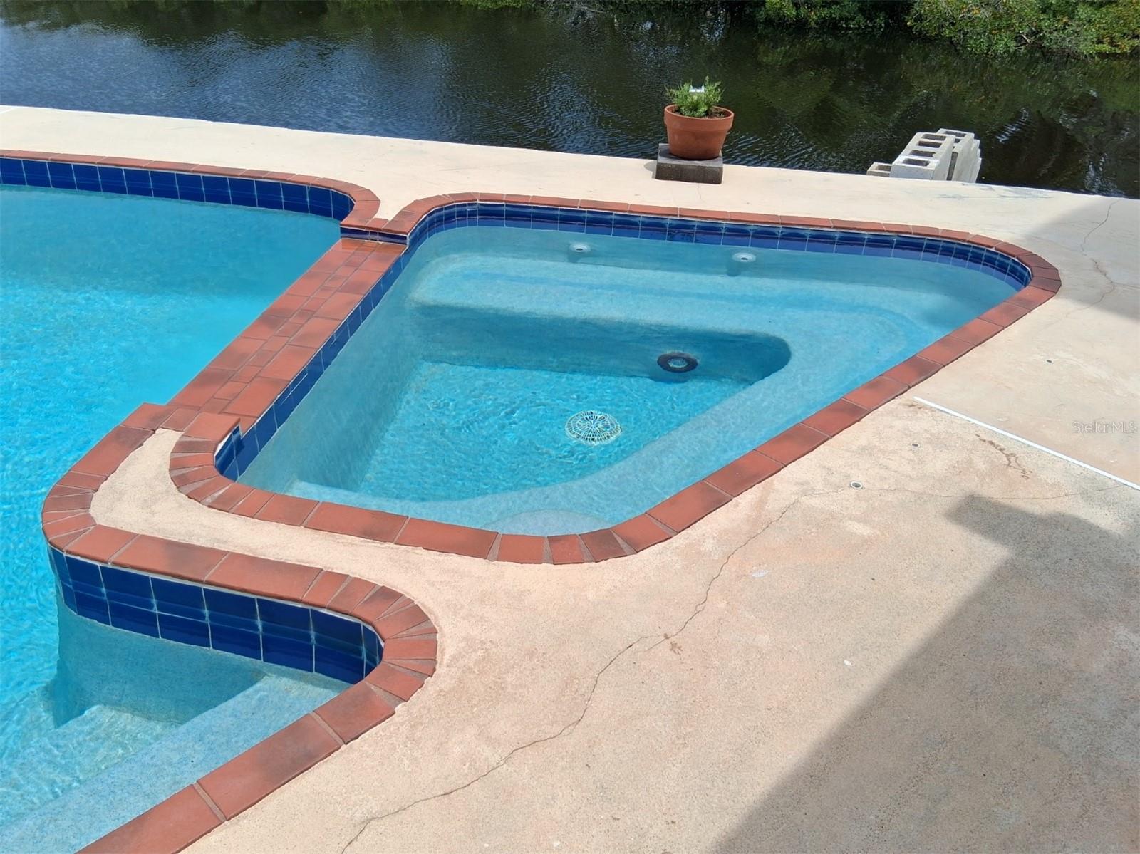Inground spa with spillover