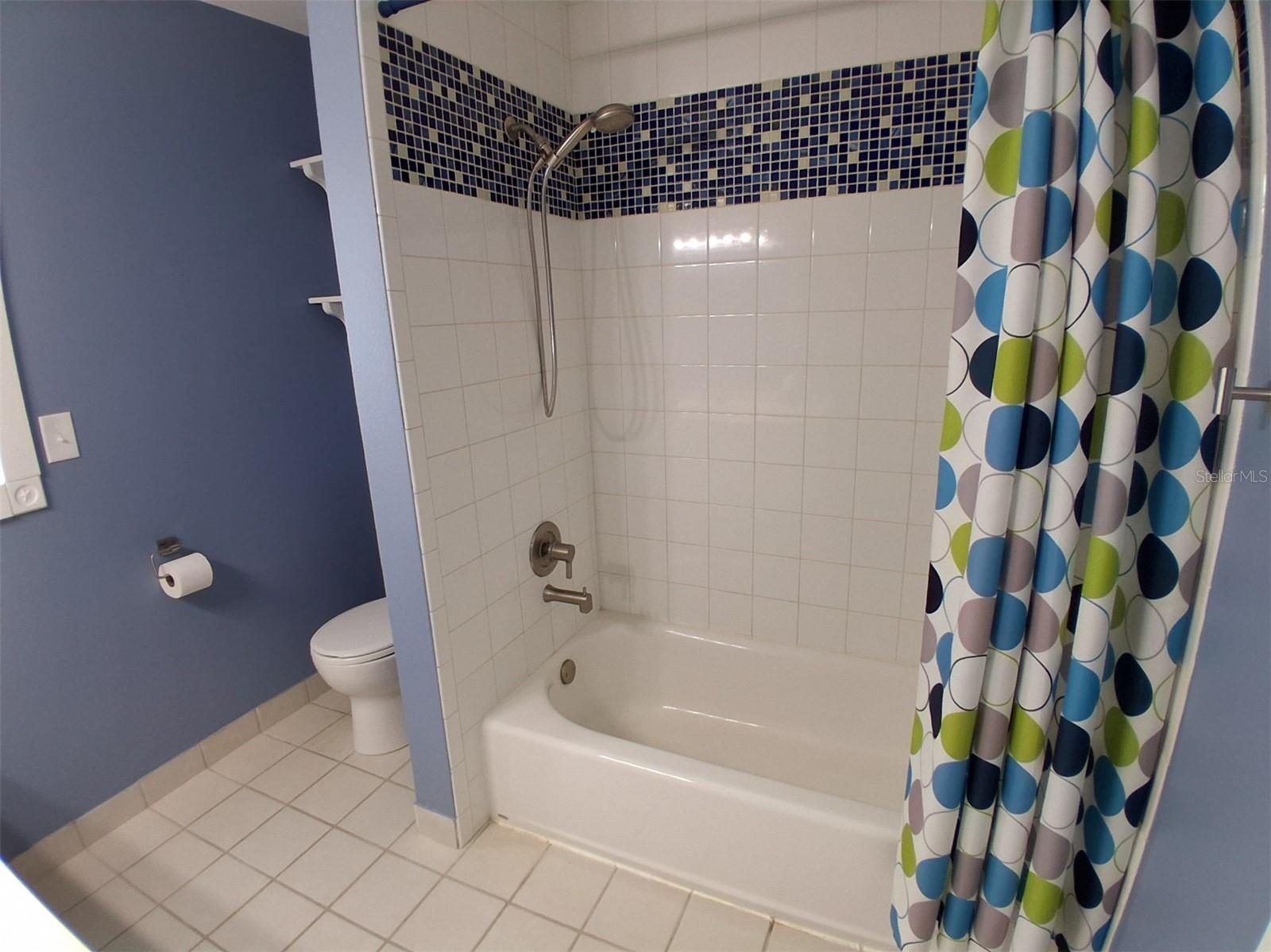 Upstairs tub with shower