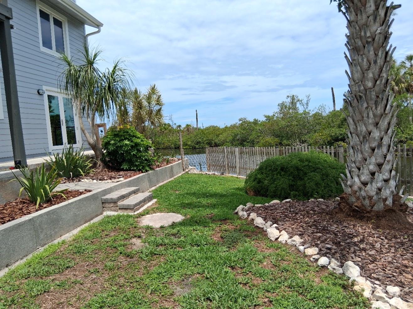 Fully fenced back yard for pooch and kids.