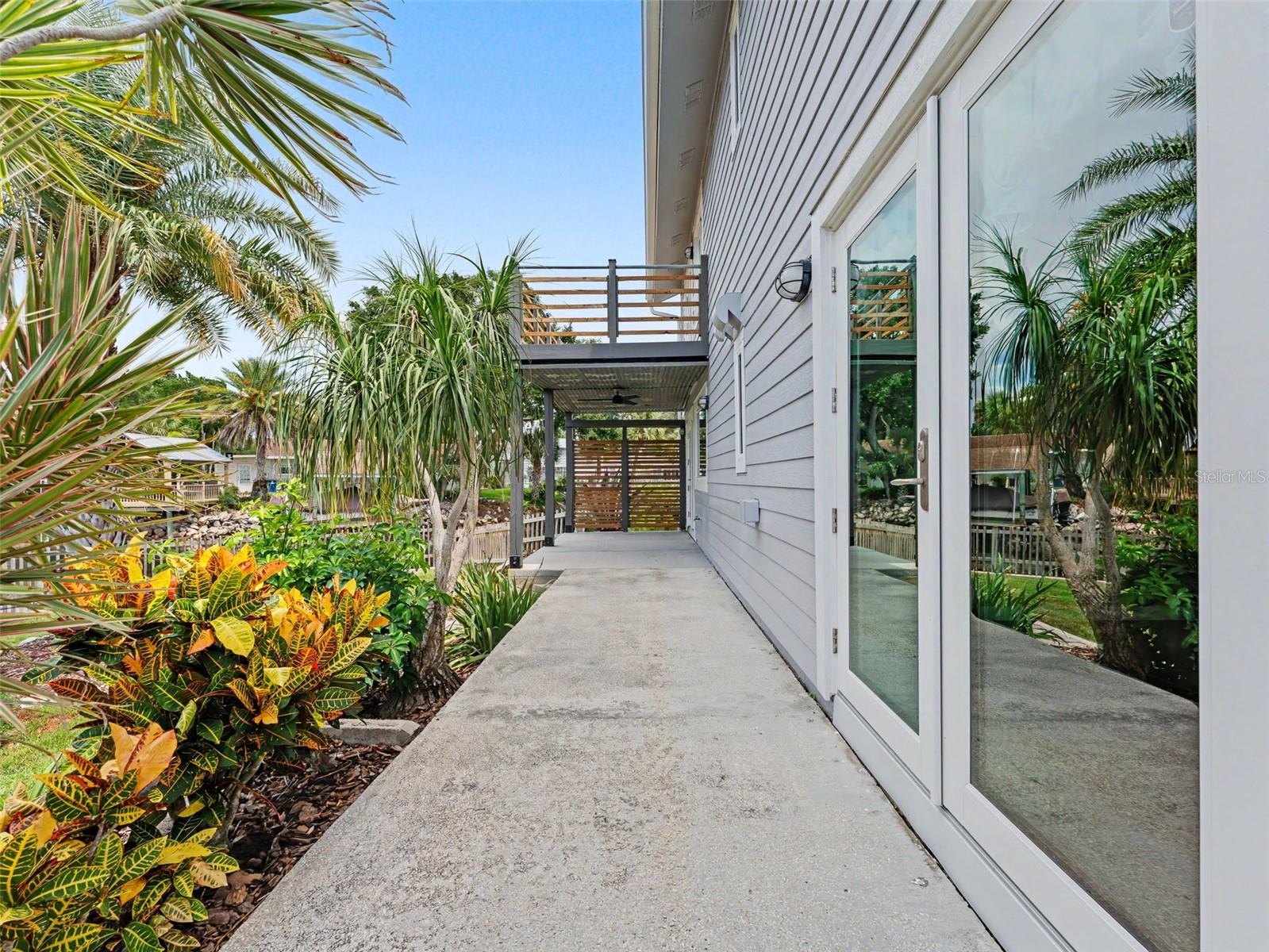 Rear walkway with covered porch at end