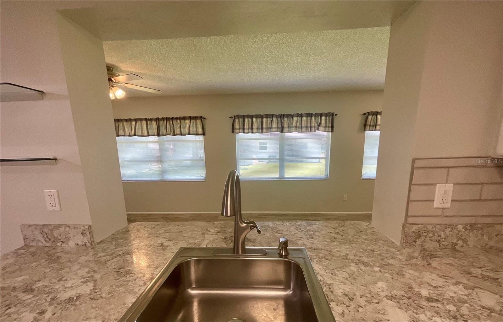 Kitchen sink area view to family room