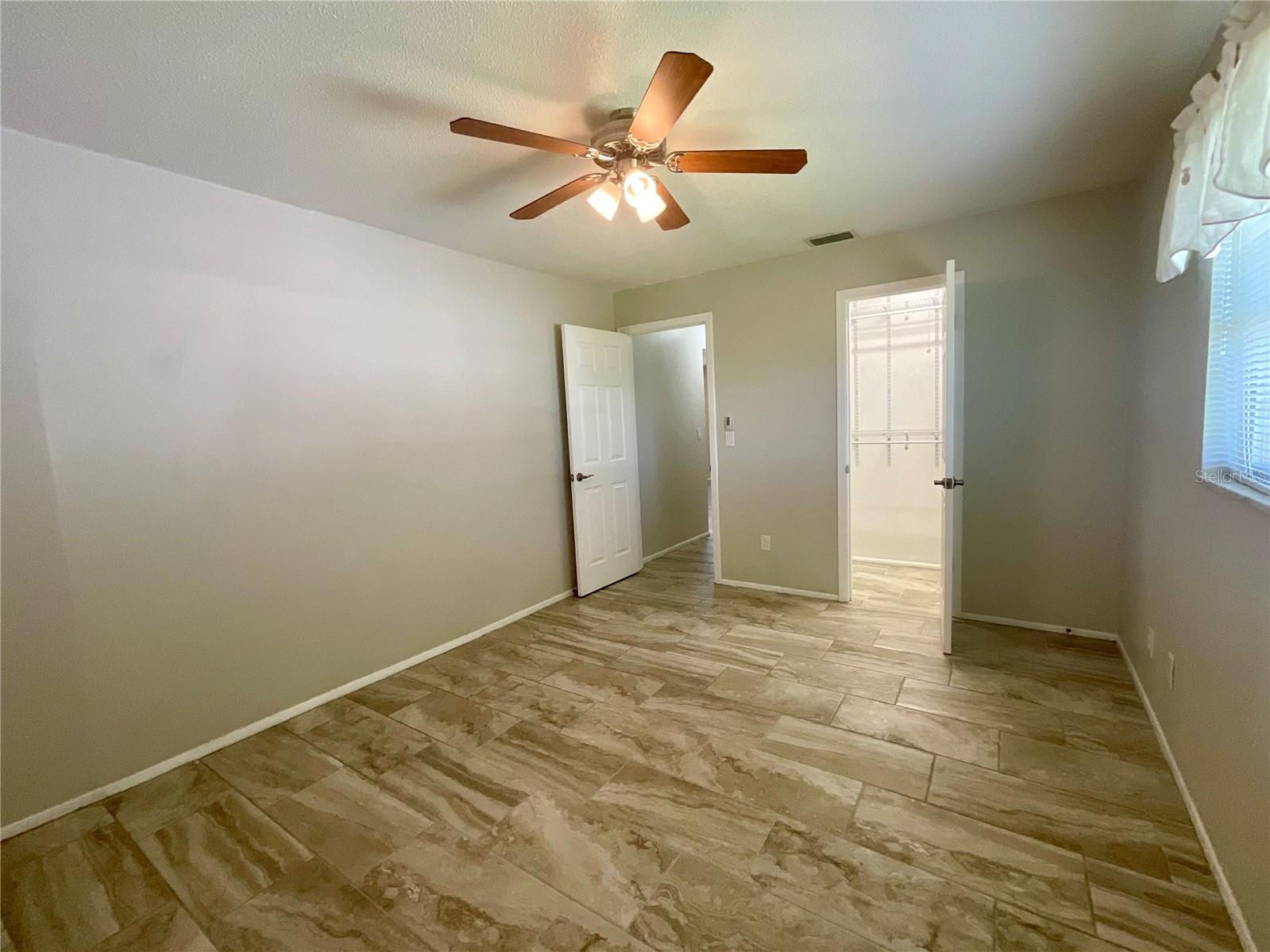 Primary Bedroom walk-in closet and door to hallway