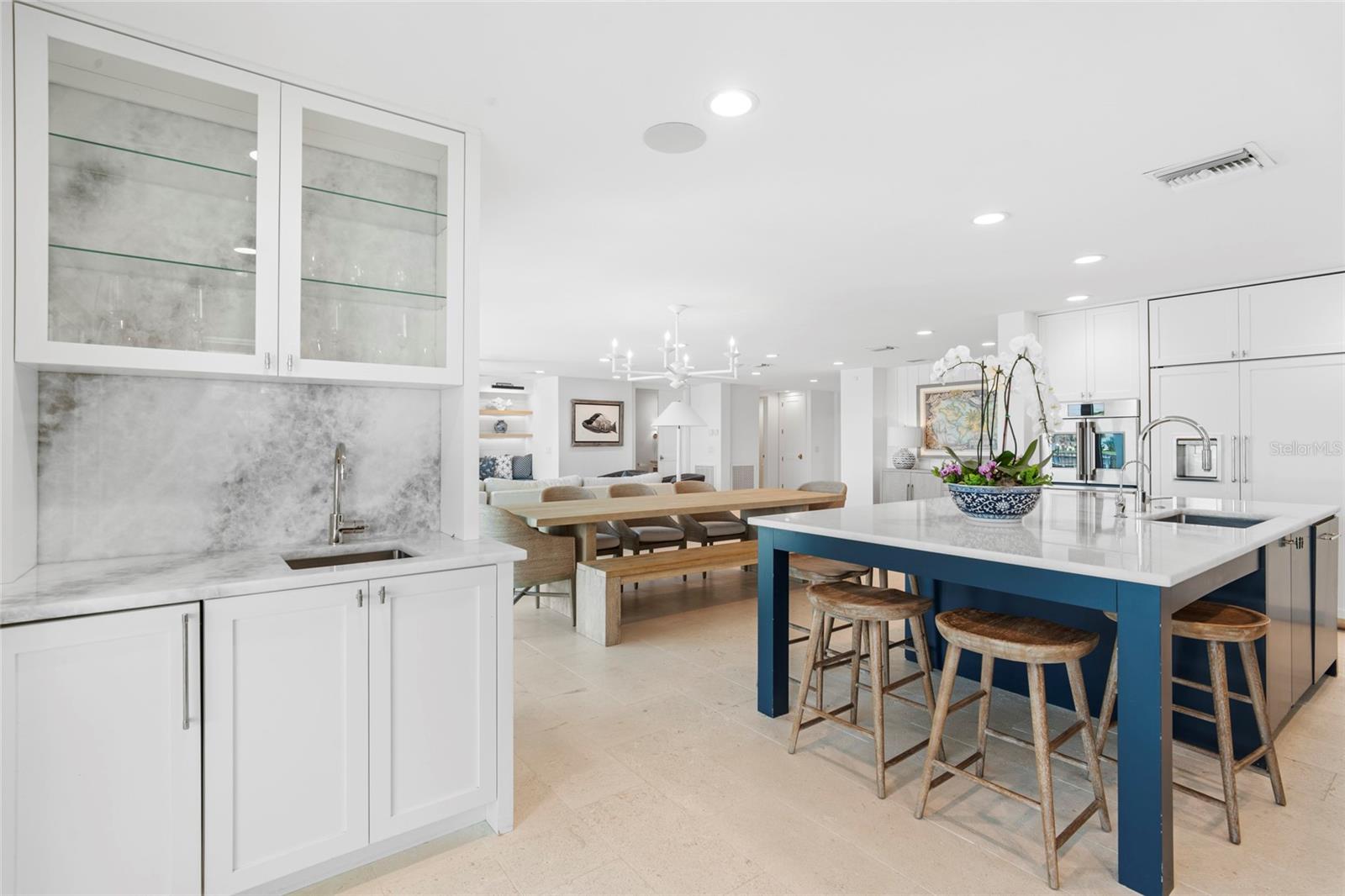 Bar/beverage area with sink and full natural stone backsplash, virtually enhanced