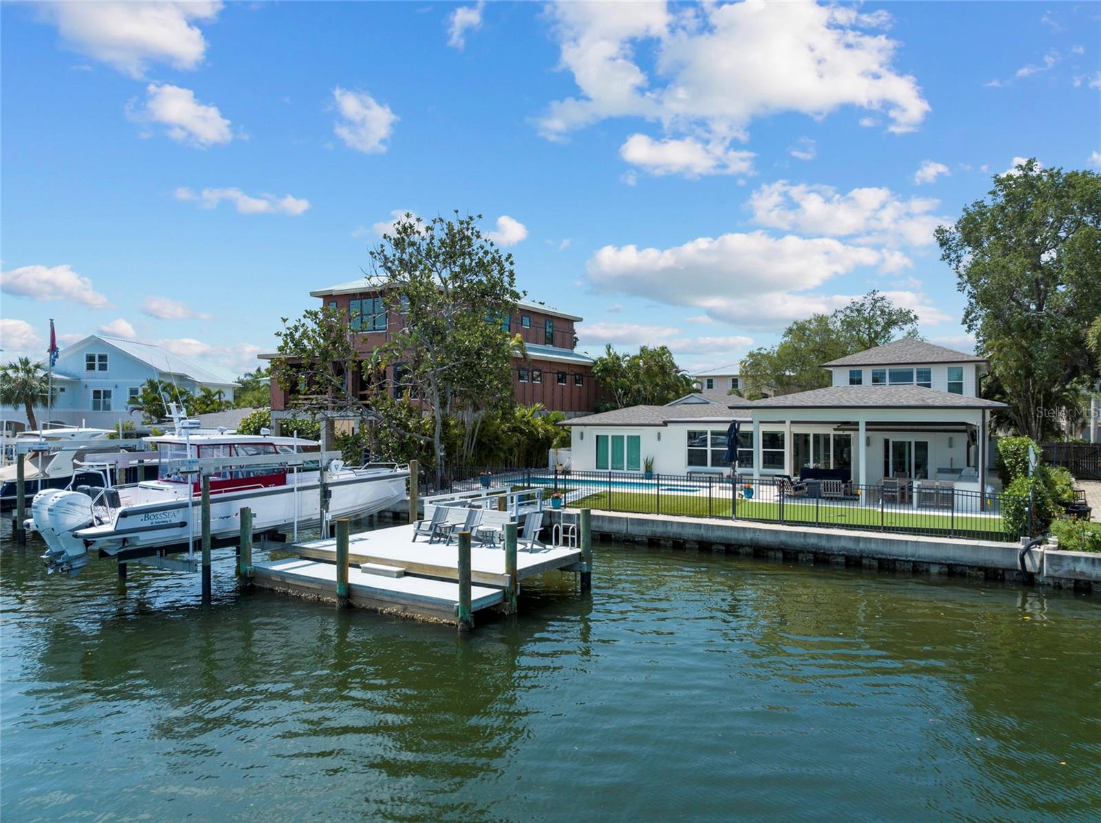 13,000 pound boat lift, large dock w/water, electric, fish cleaning station