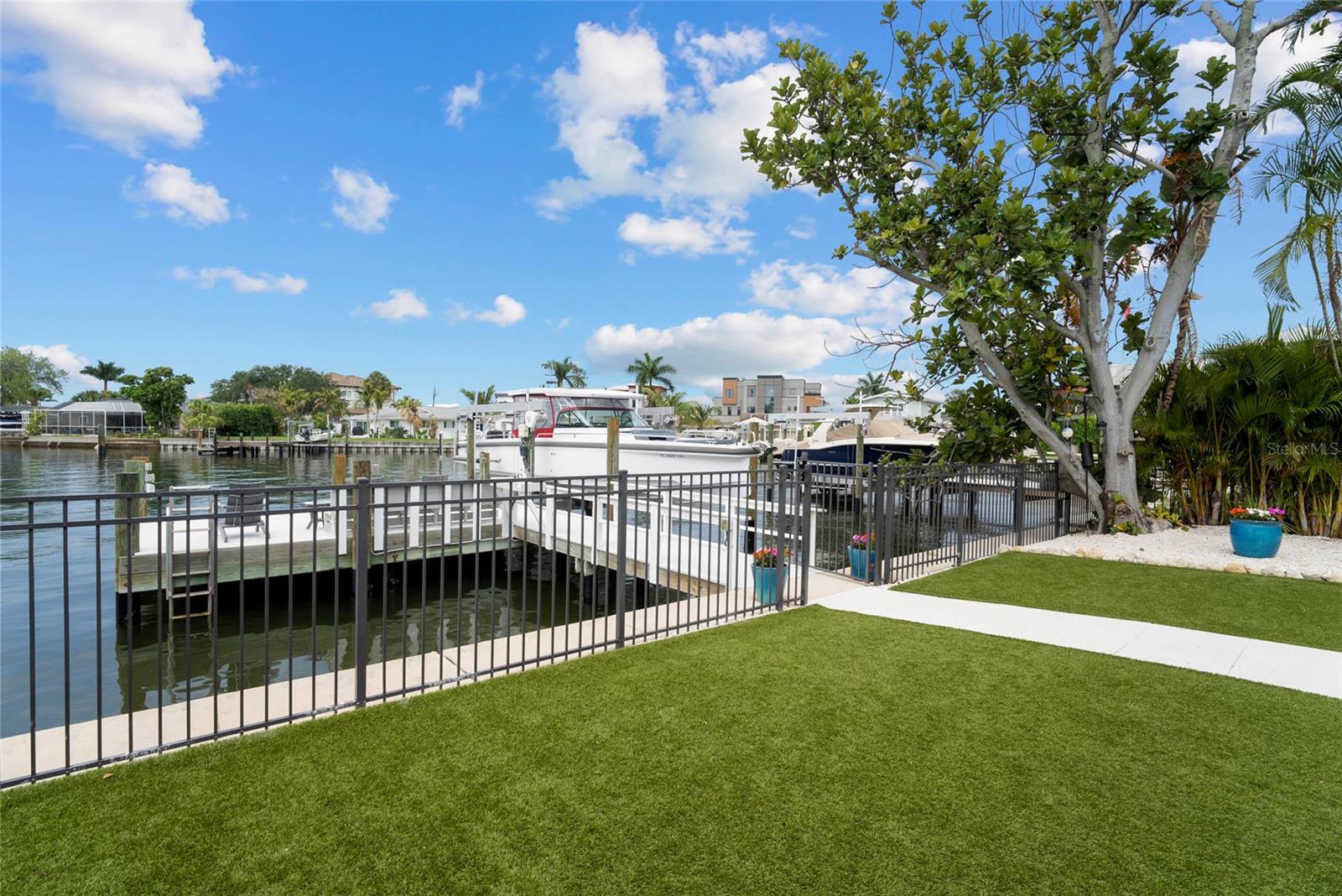 fenced yard and pavers prepped for pool childproof fencing