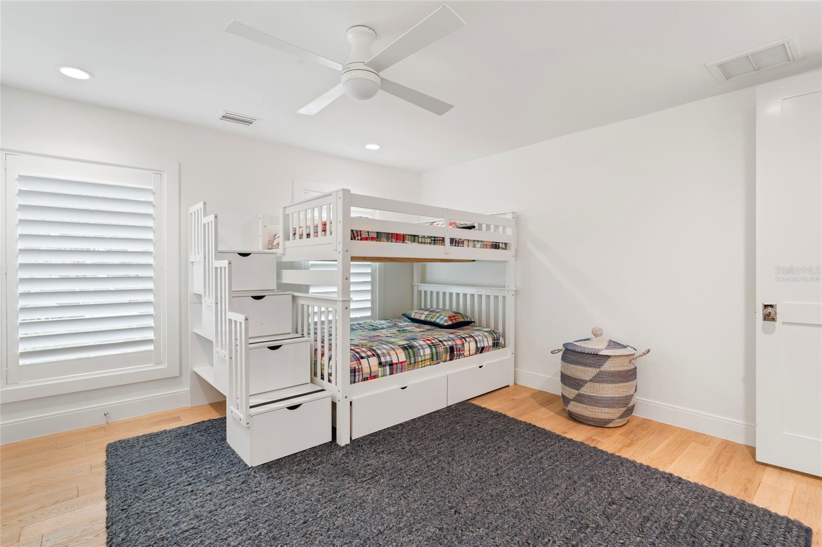bedroom 3 w/ shell stone tile & double closets, virtually staged