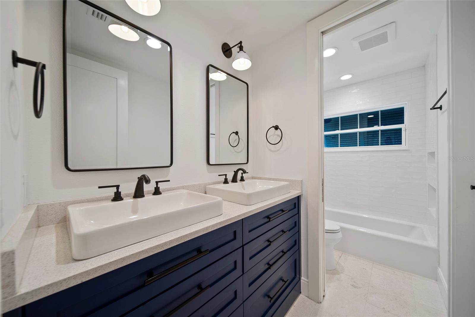 Bath w/ custom cabinetry, upscale fixtures